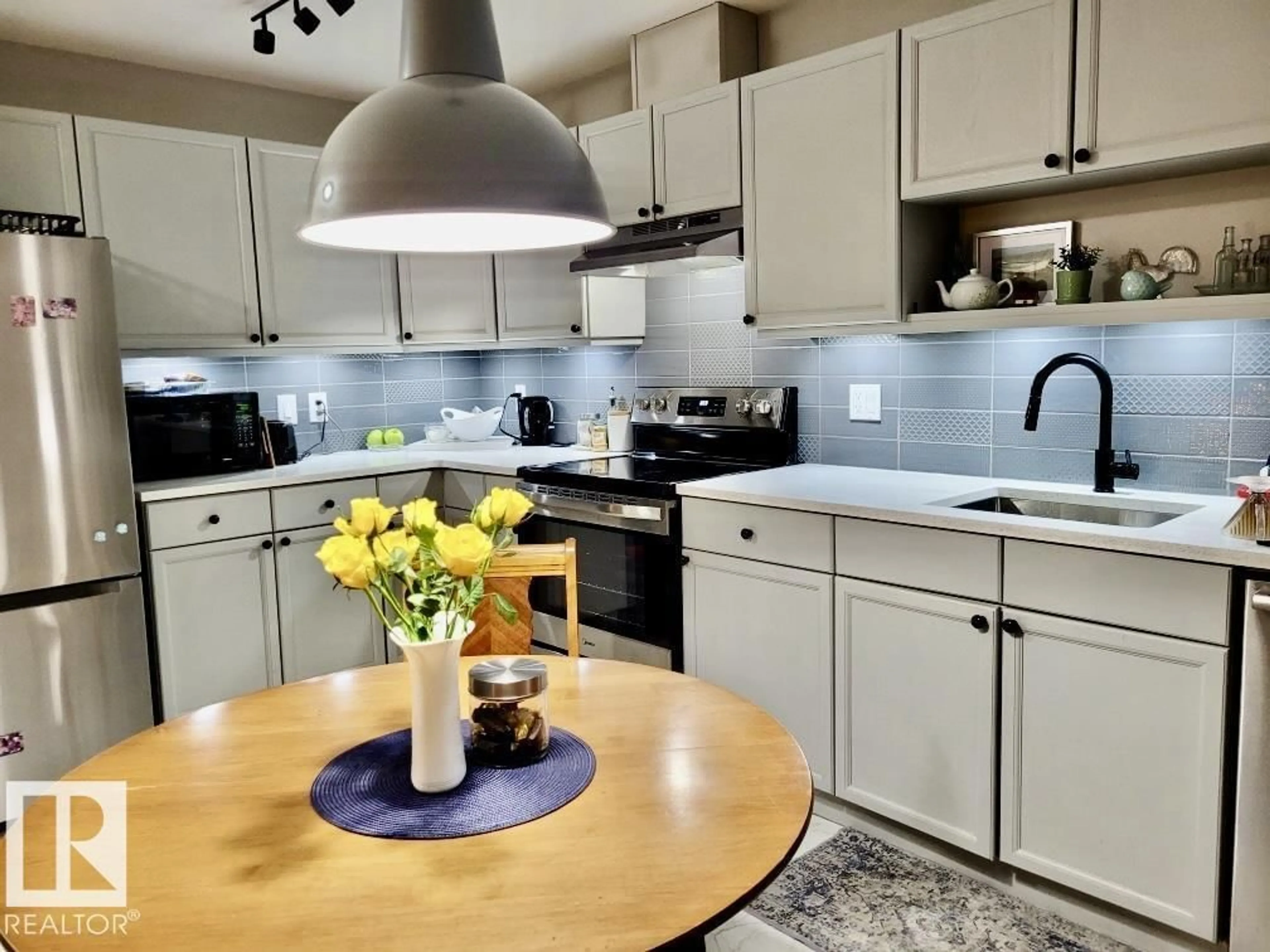 Open concept kitchen, unknown for 592 - 135 HOOKE RD, Edmonton Alberta T5A5H2