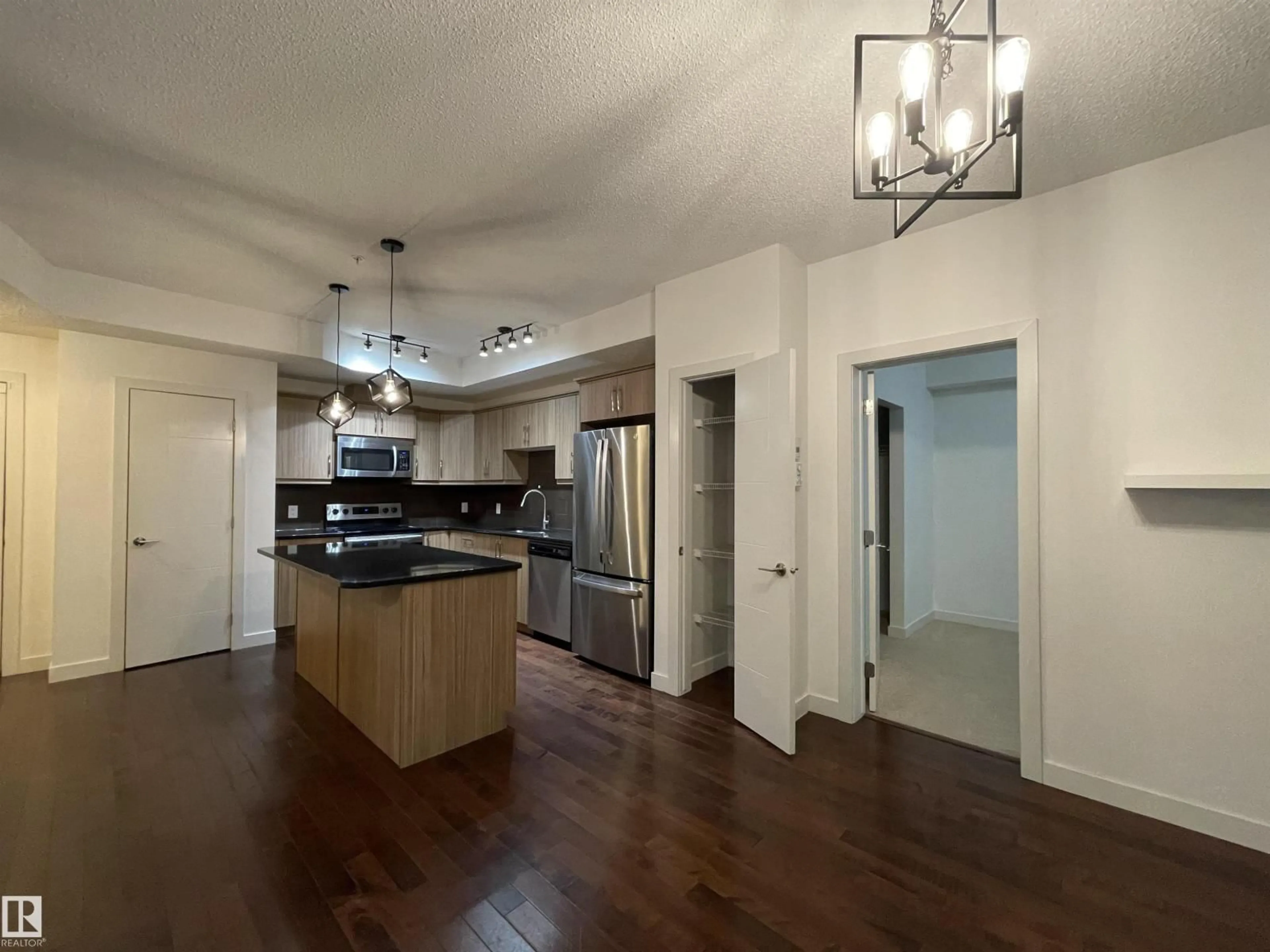 Open concept kitchen, unknown for #115 - 10523 123 ST, Edmonton Alberta T5N1N9