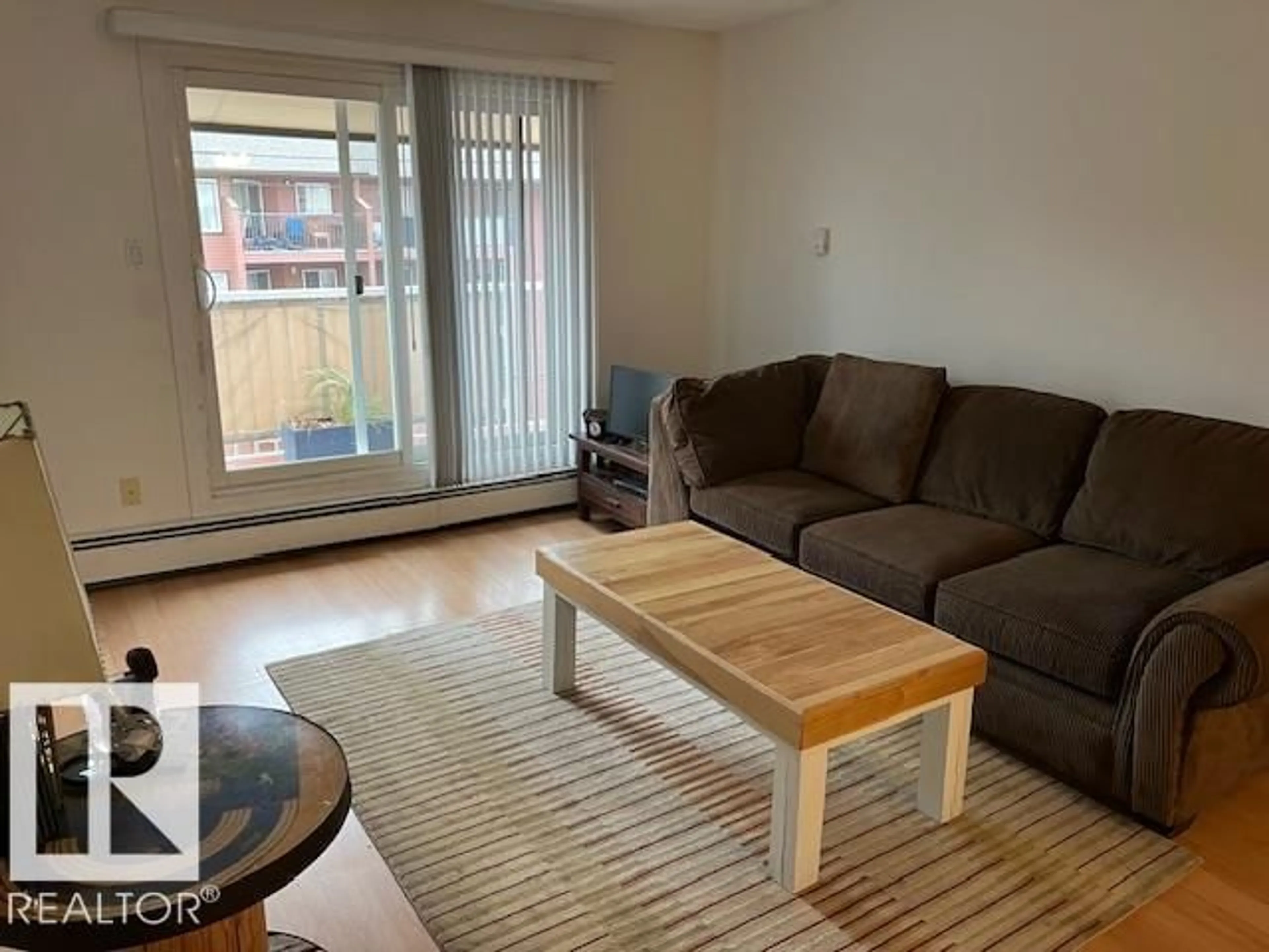 Living room with furniture, wood/laminate floor for #407 - 10529 93 ST, Edmonton Alberta T5H1X6