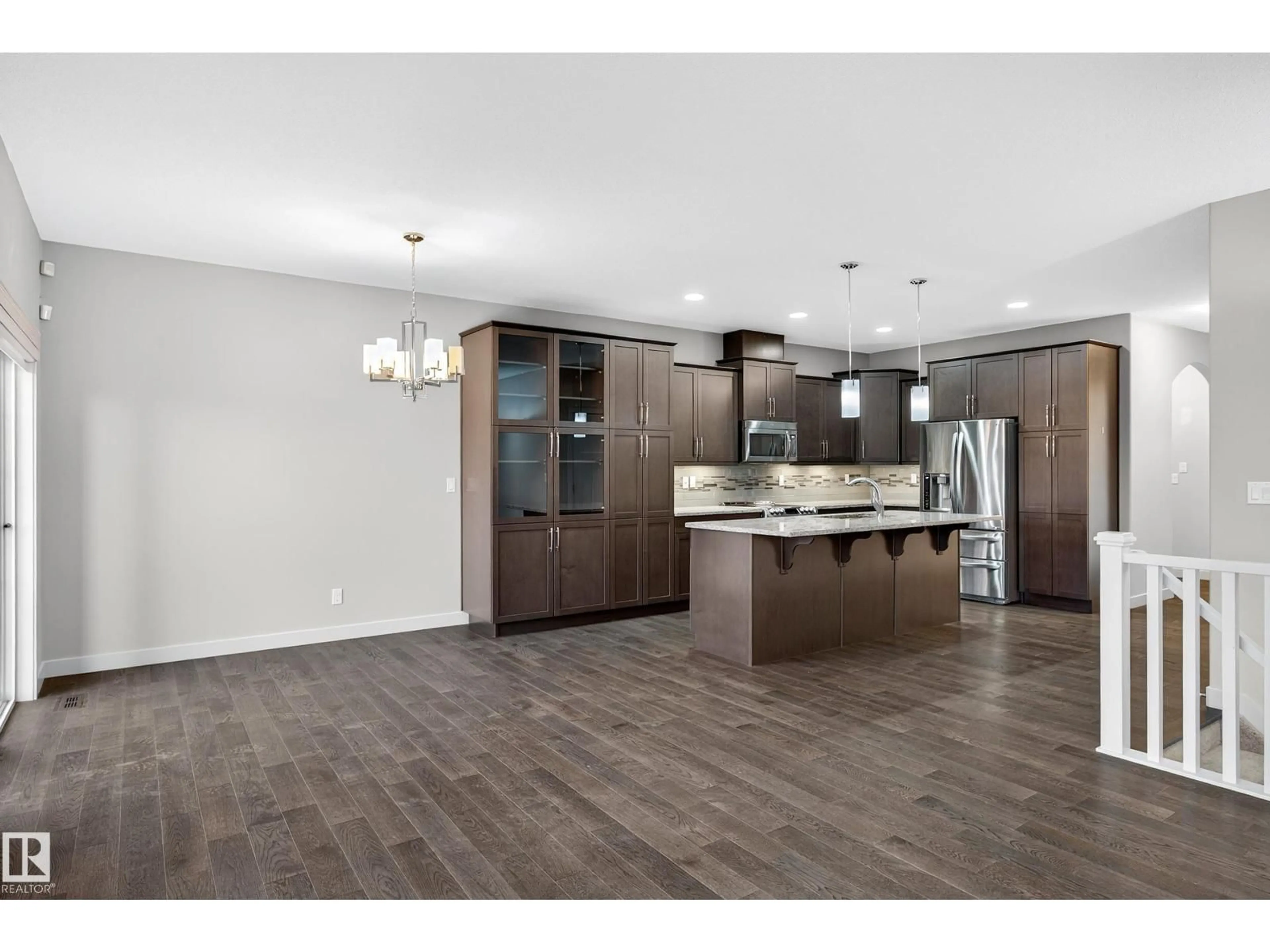 Open concept kitchen, wood/laminate floor for #13 - 8132 217 ST NW, Edmonton Alberta T5T4S1