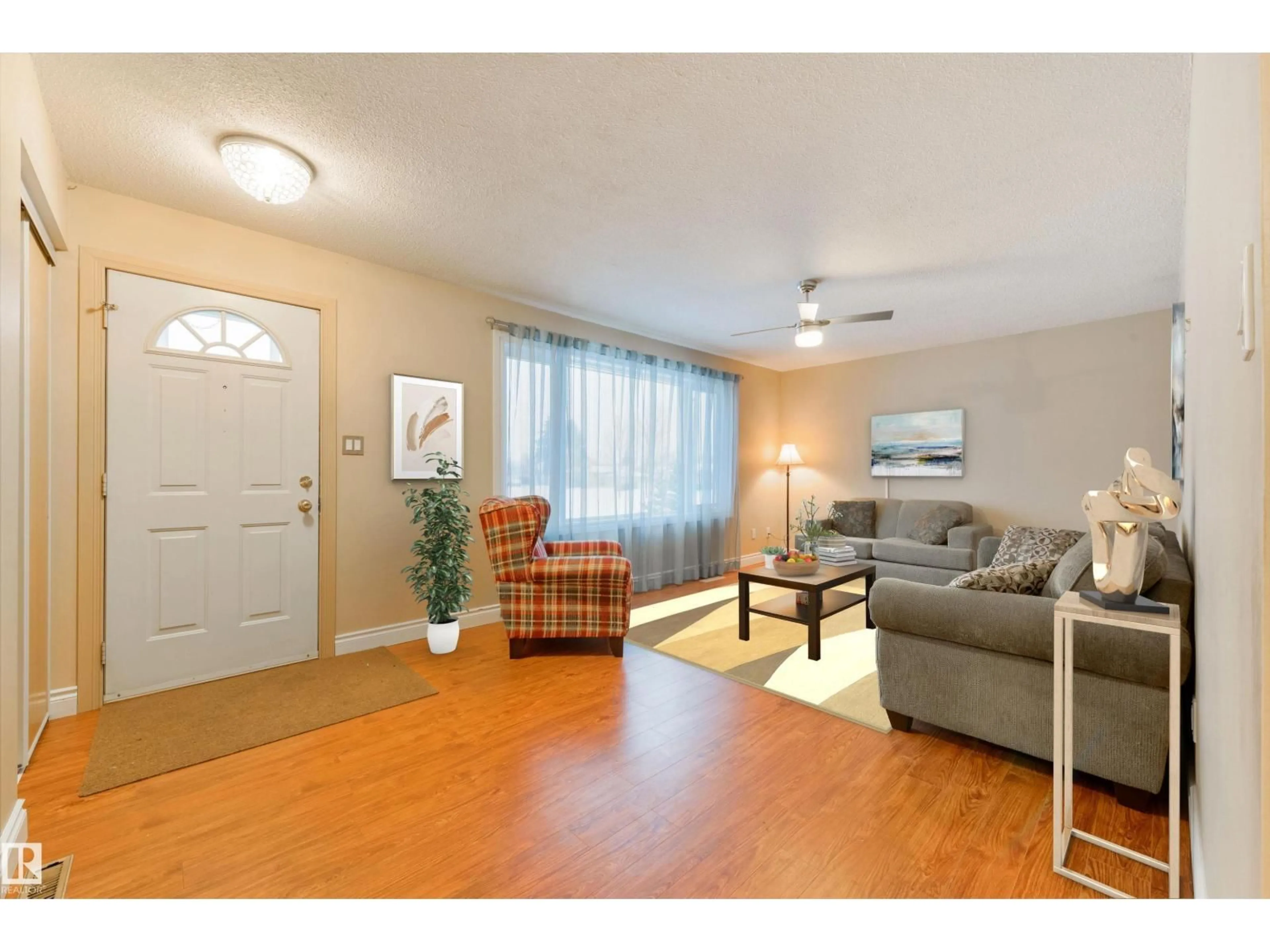 Living room with furniture, wood/laminate floor for 13420 60 ST, Edmonton Alberta T5A0S6