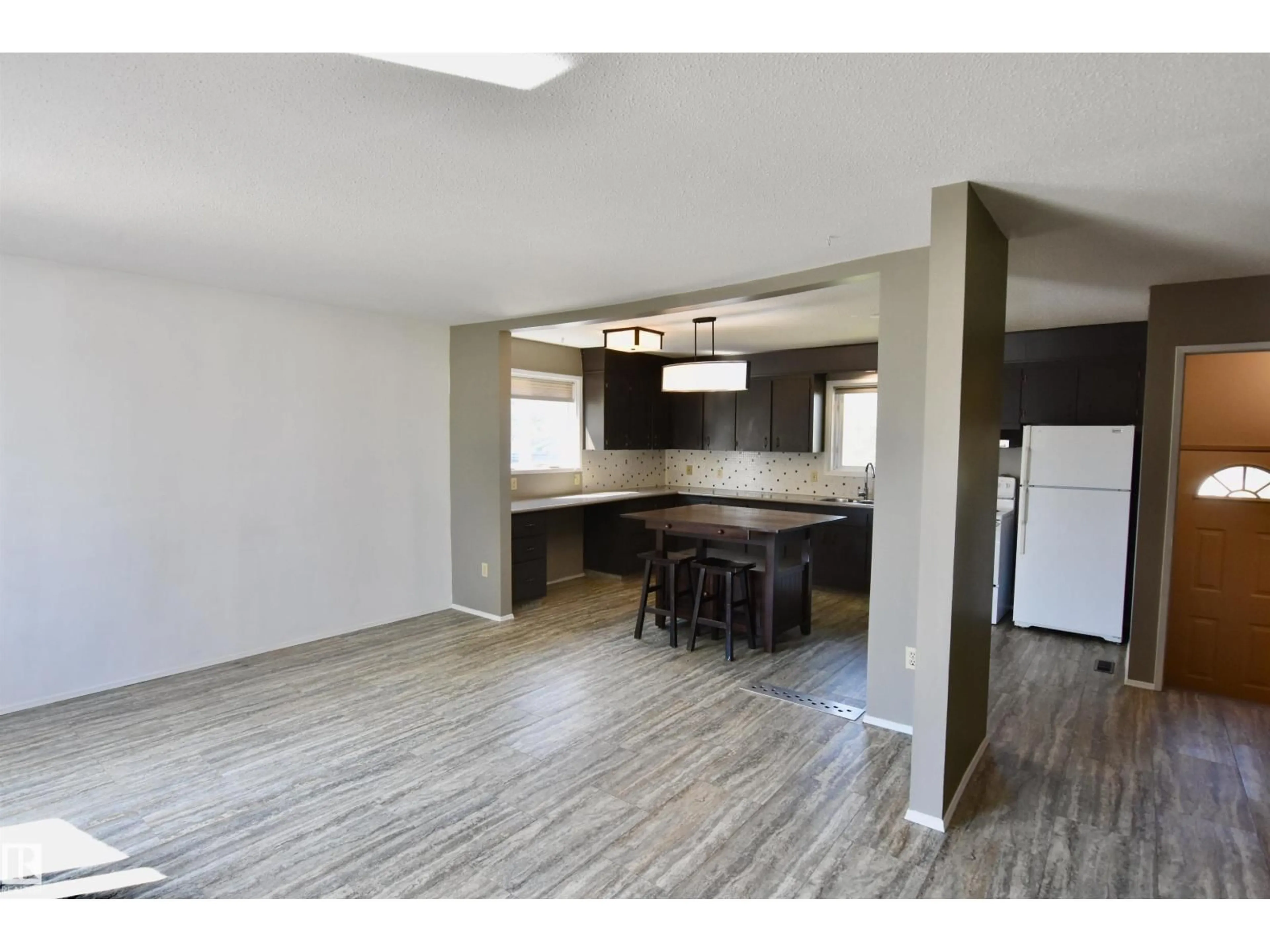 Open concept kitchen, wood/laminate floor for 4930 44 AV, St. Paul Town Alberta T0A3A4