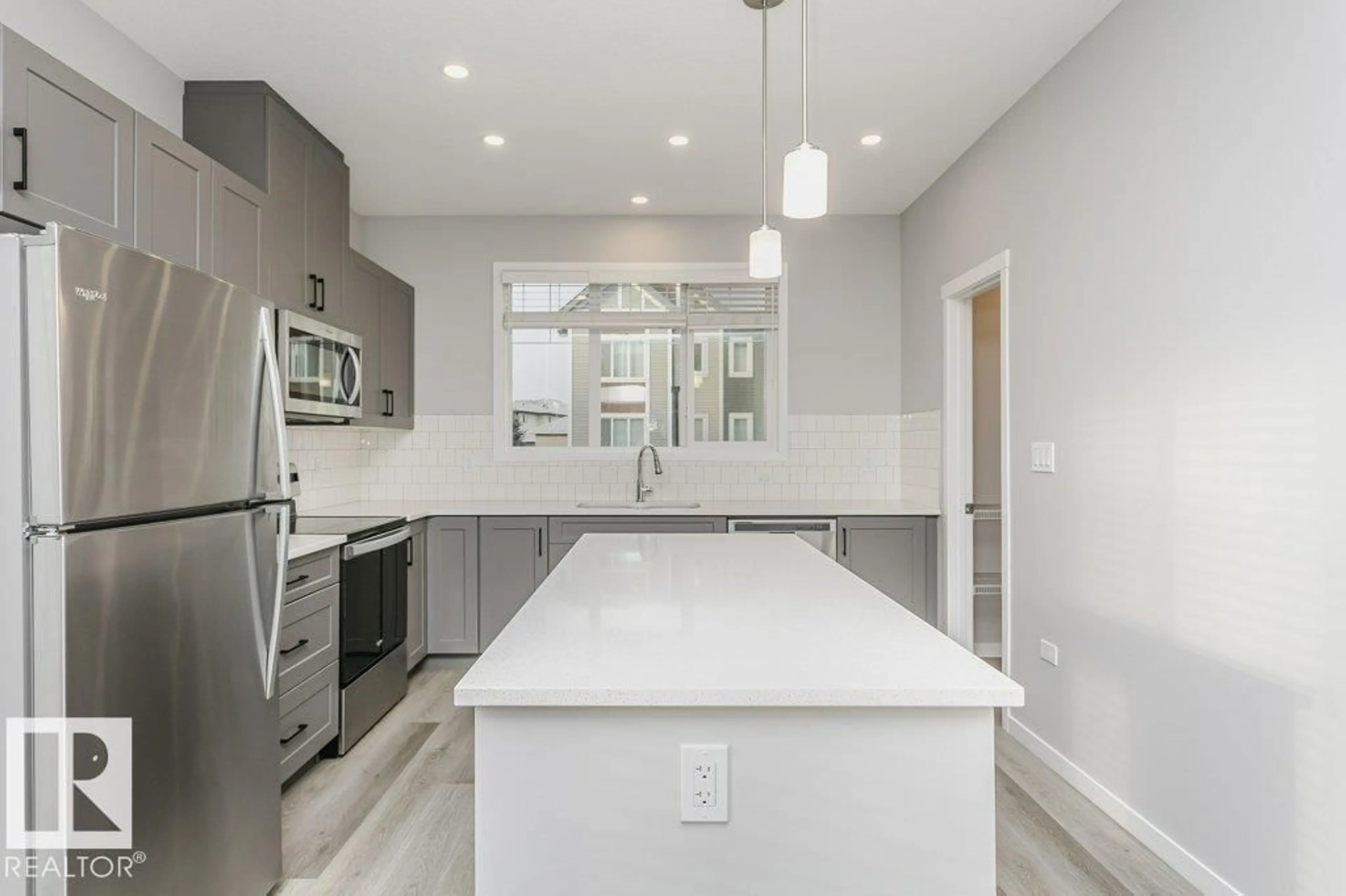 Open concept kitchen, ceramic/tile floor for #101 - 320 SECORD BV, Edmonton Alberta T5T7E8