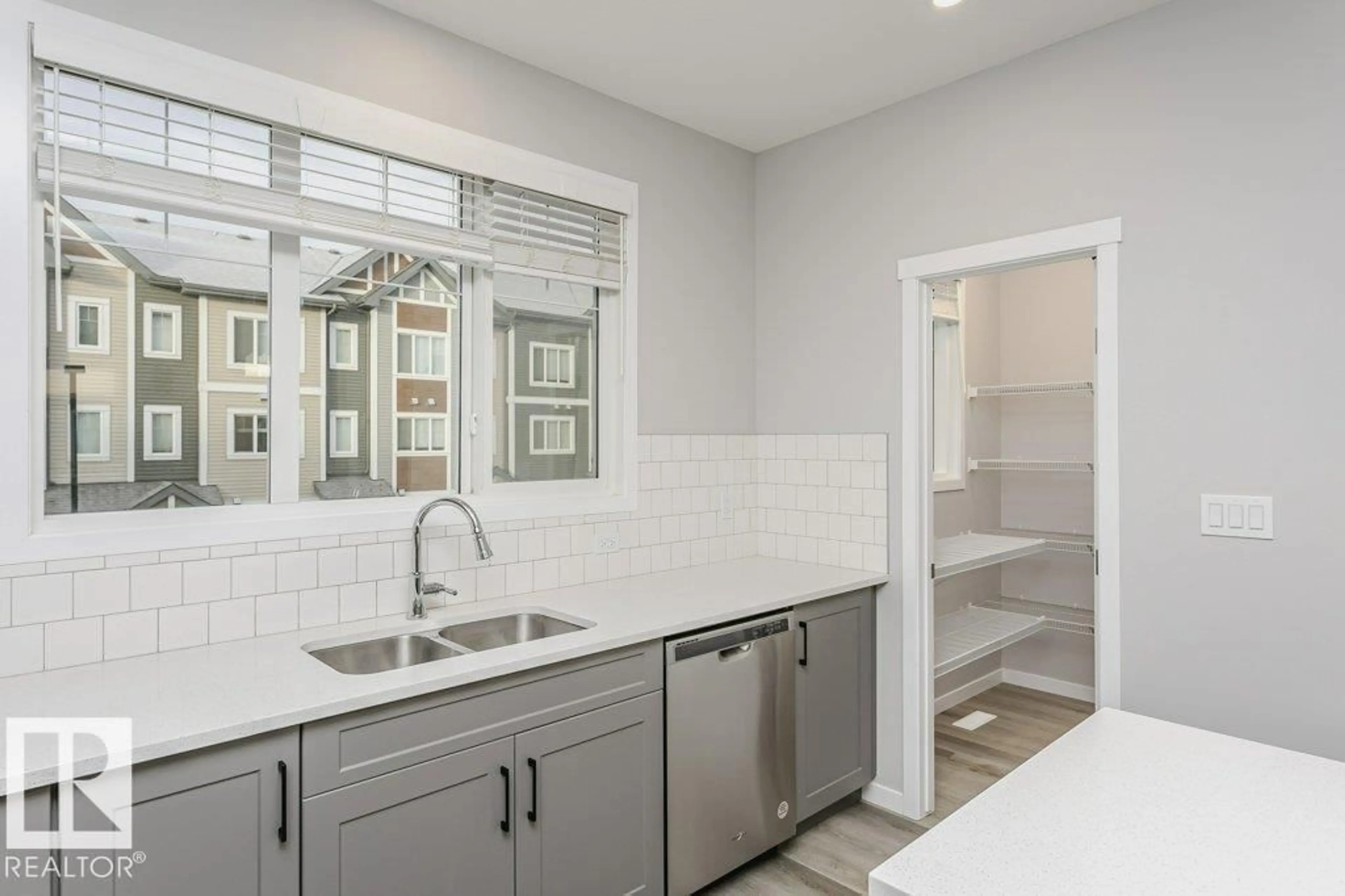 Open concept kitchen, ceramic/tile floor for #101 - 320 SECORD BV, Edmonton Alberta T5T7E8