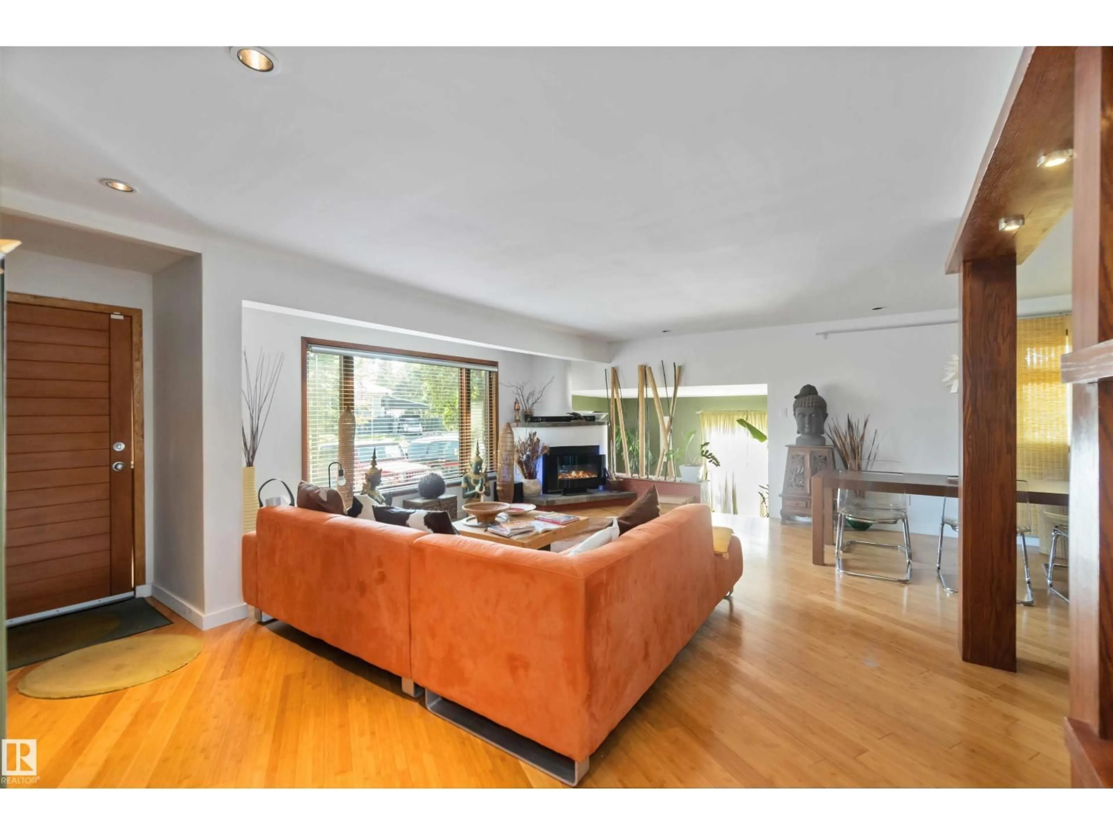 Living room with furniture, wood/laminate floor for 11026 110 AV NW, Edmonton Alberta T5H1H9