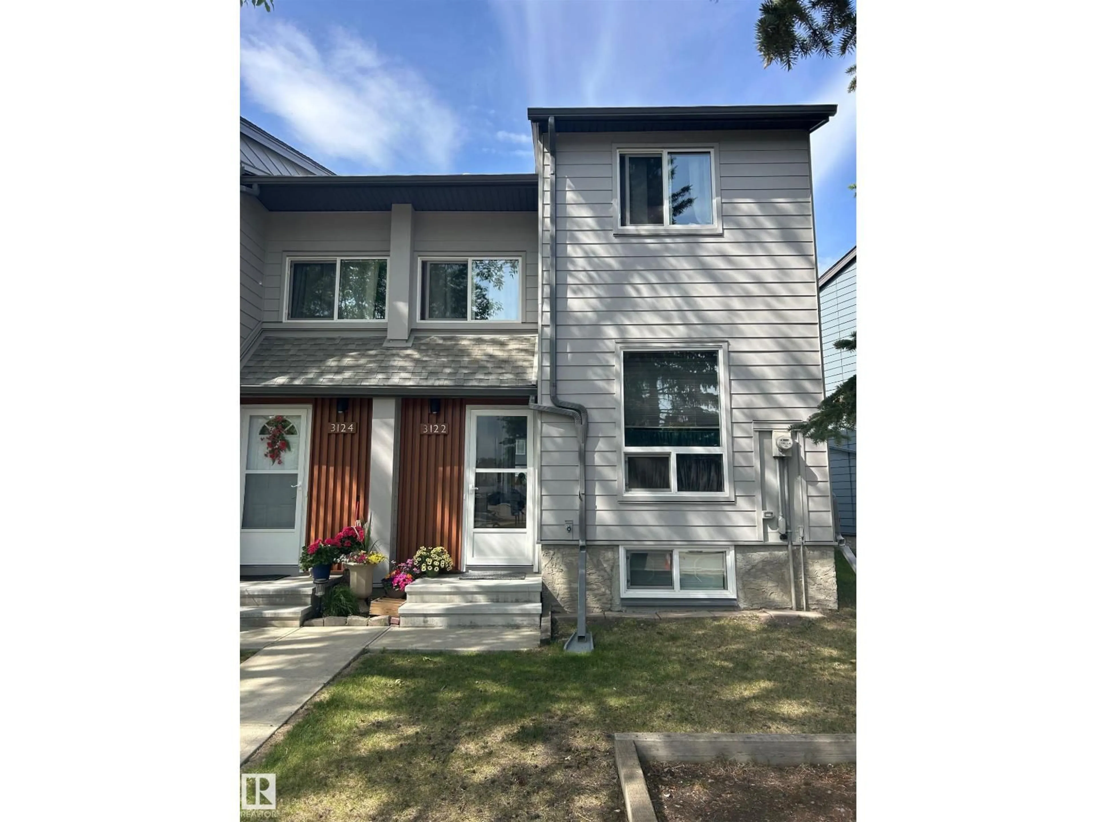 Home with vinyl exterior material, street for 3122 142 AV, Edmonton Alberta T5Y1H2