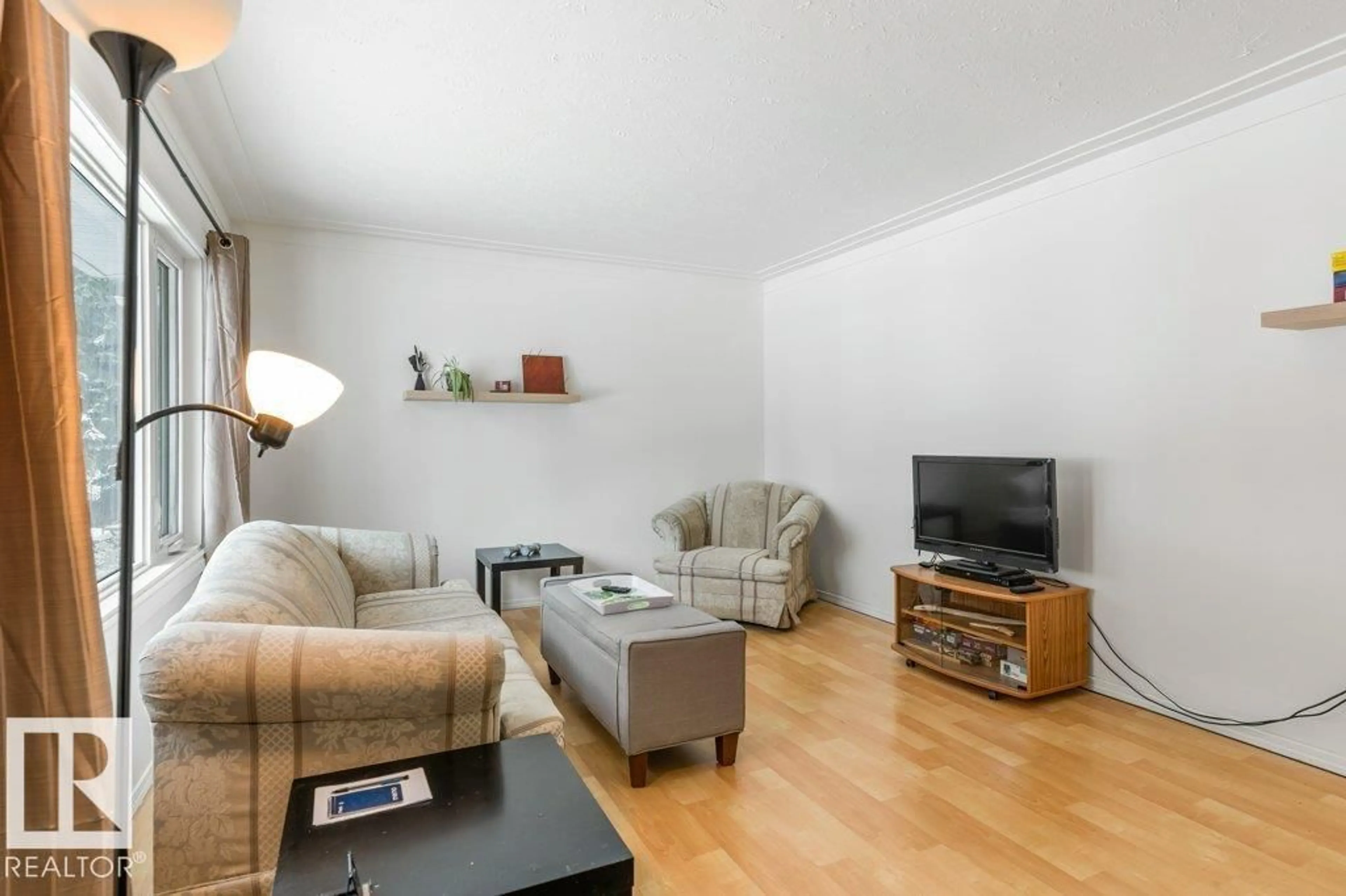 Living room with furniture, wood/laminate floor for 9 MURAL CR, St. Albert Alberta T8N1J8