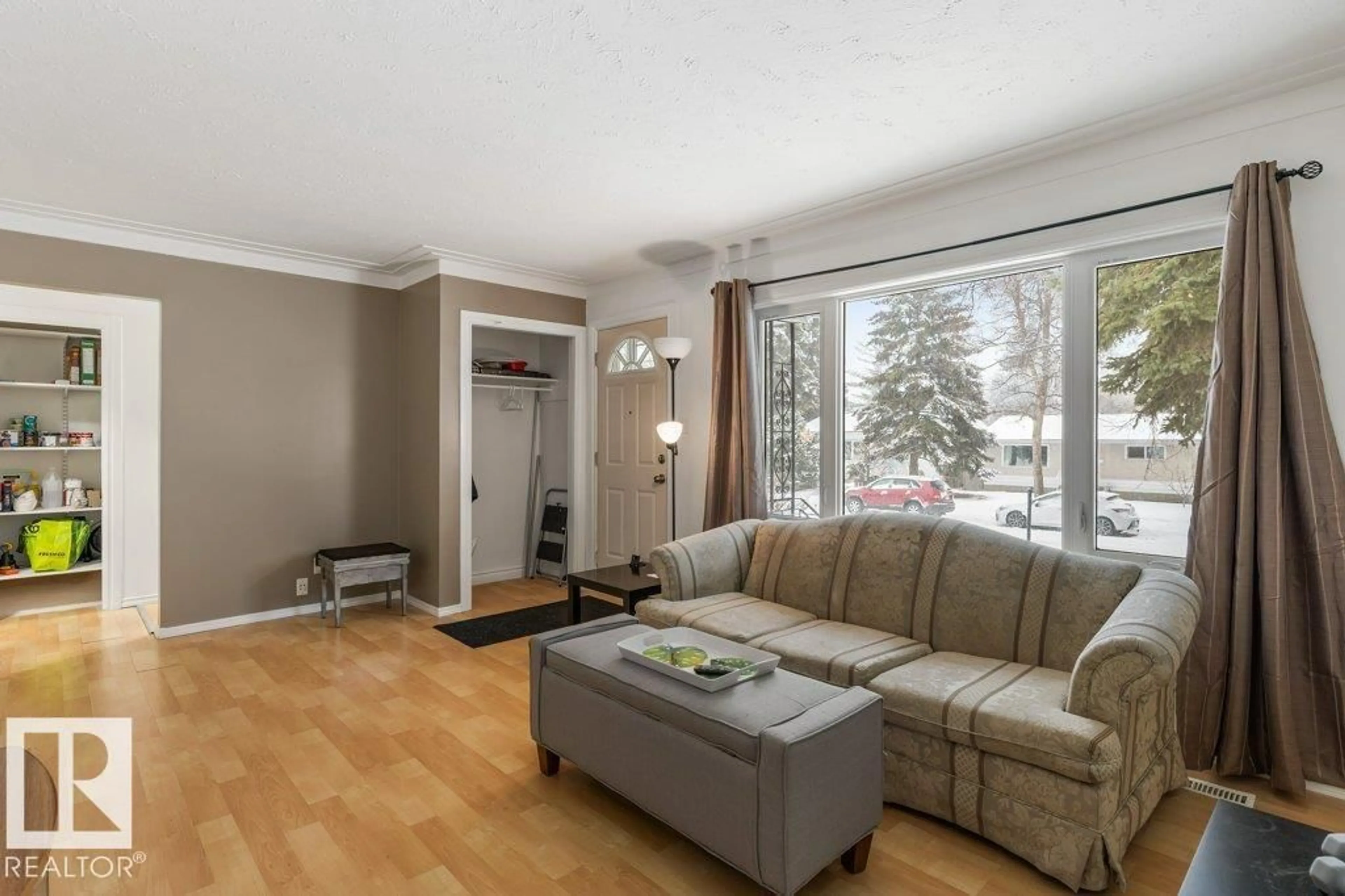 Living room with furniture, wood/laminate floor for 9 MURAL CR, St. Albert Alberta T8N1J8