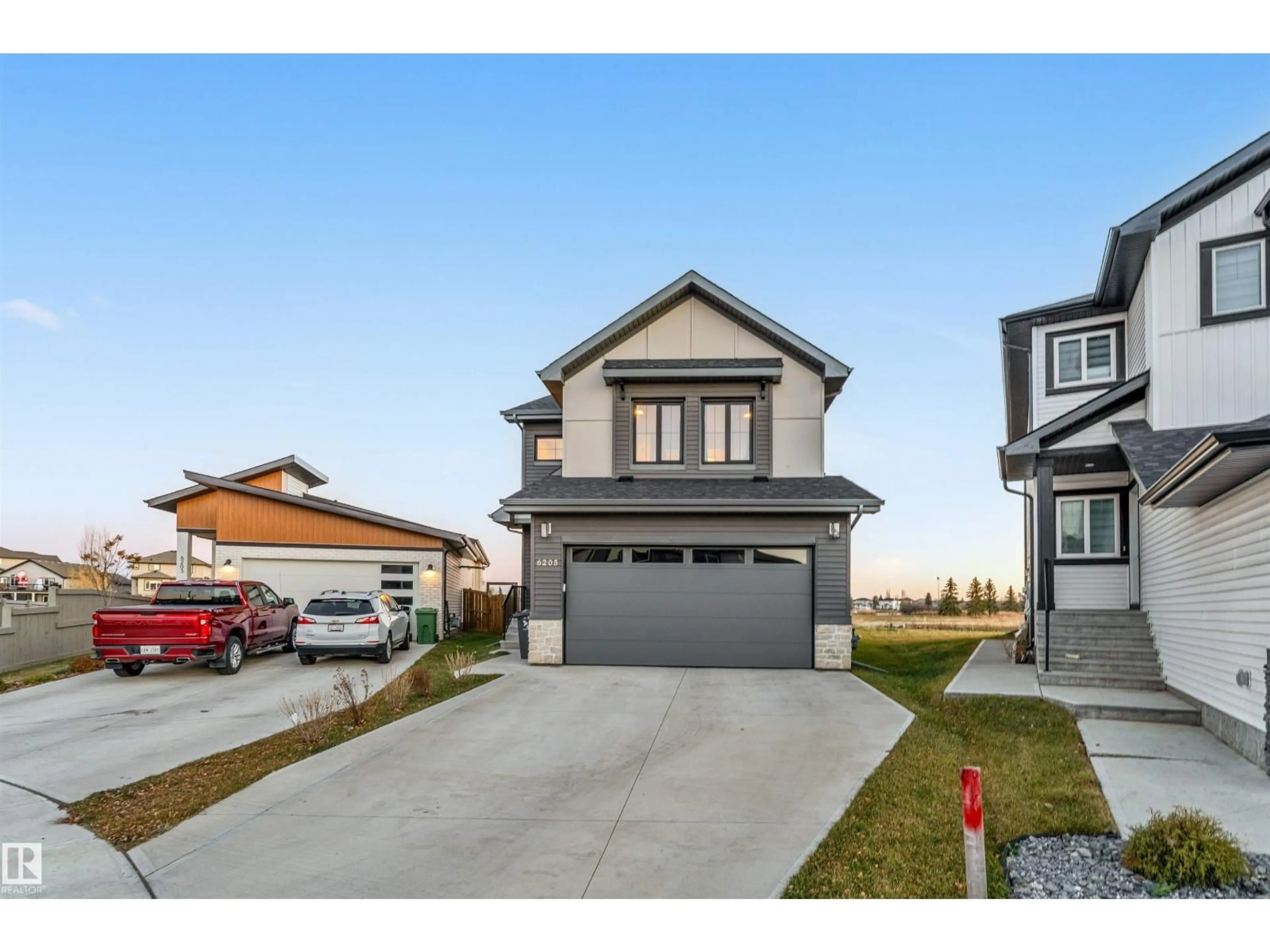 Home with vinyl exterior material, street for 6205 46 AV, Beaumont Alberta T4X2Z2