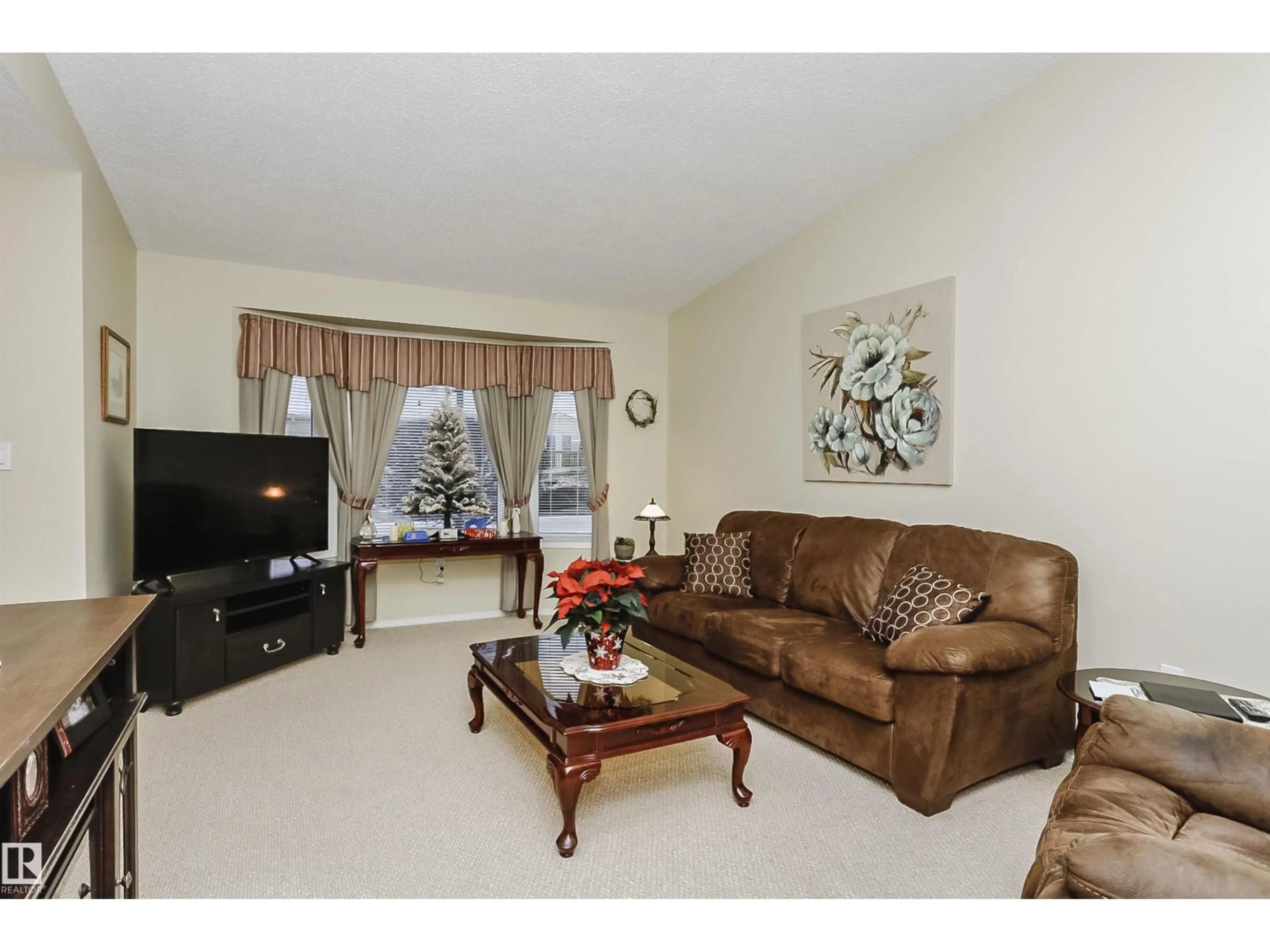 Living room with furniture, unknown for 10105 105 ST, Morinville Alberta T8R1V8