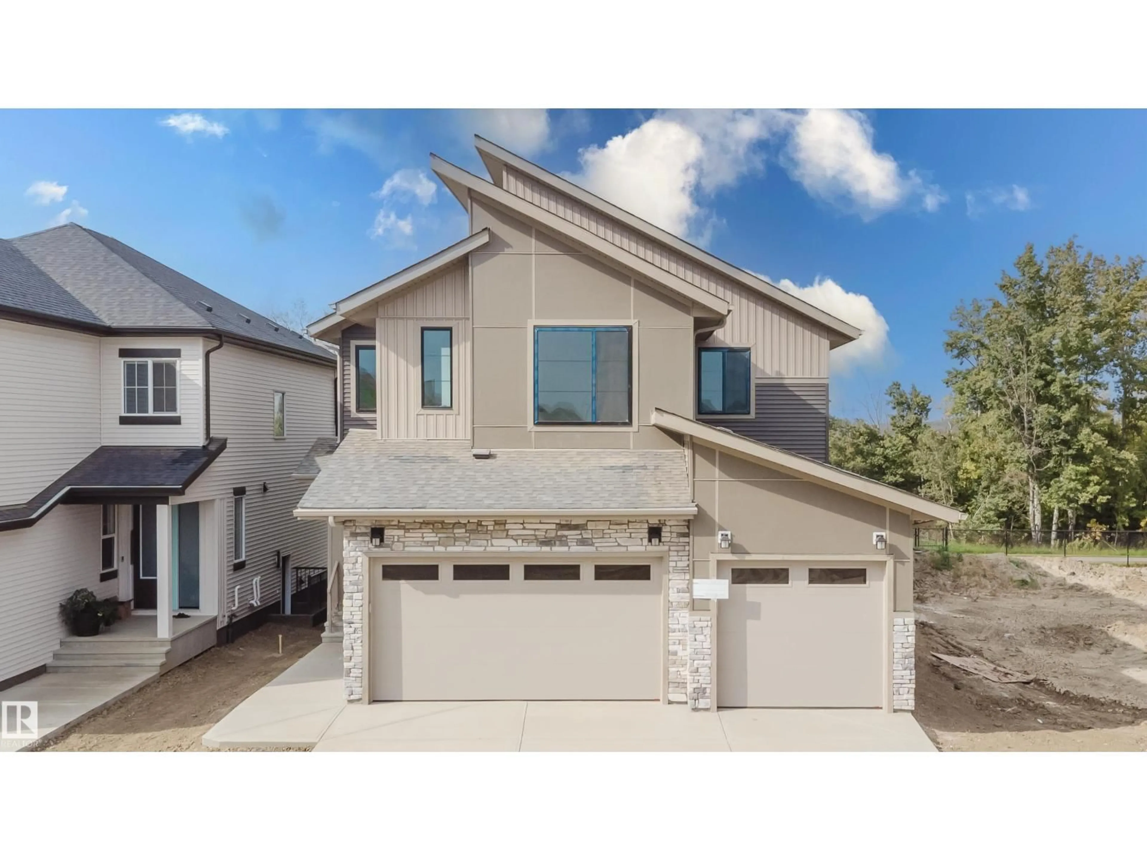 Home with vinyl exterior material, street for NW - 2512 213 ST, Edmonton Alberta T6M3H3