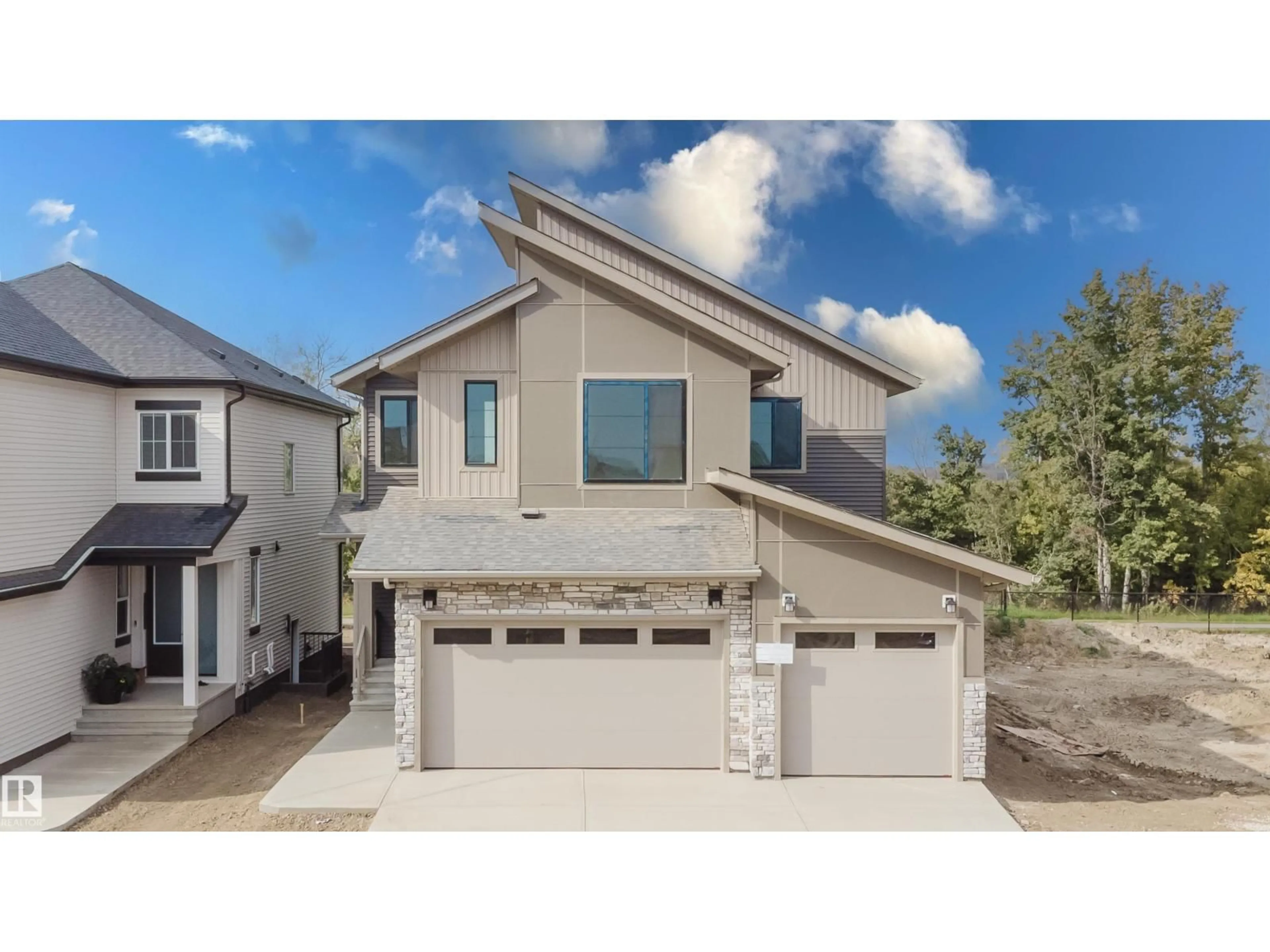 Home with vinyl exterior material, street for NW - 2512 213 ST, Edmonton Alberta T6M3H3