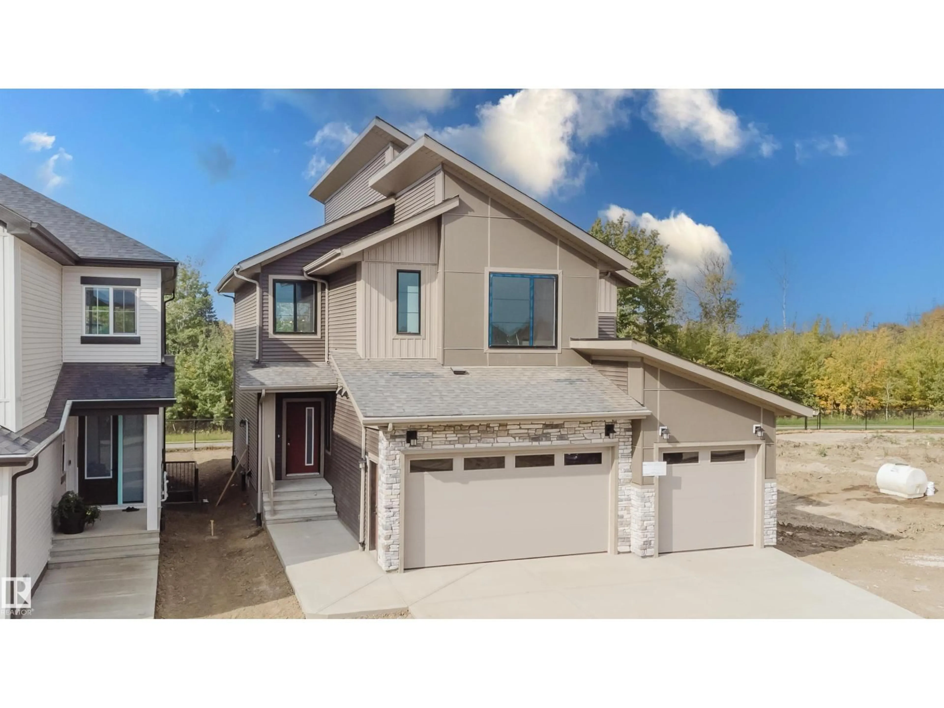 Home with vinyl exterior material, street for NW - 2512 213 ST, Edmonton Alberta T6M3H3