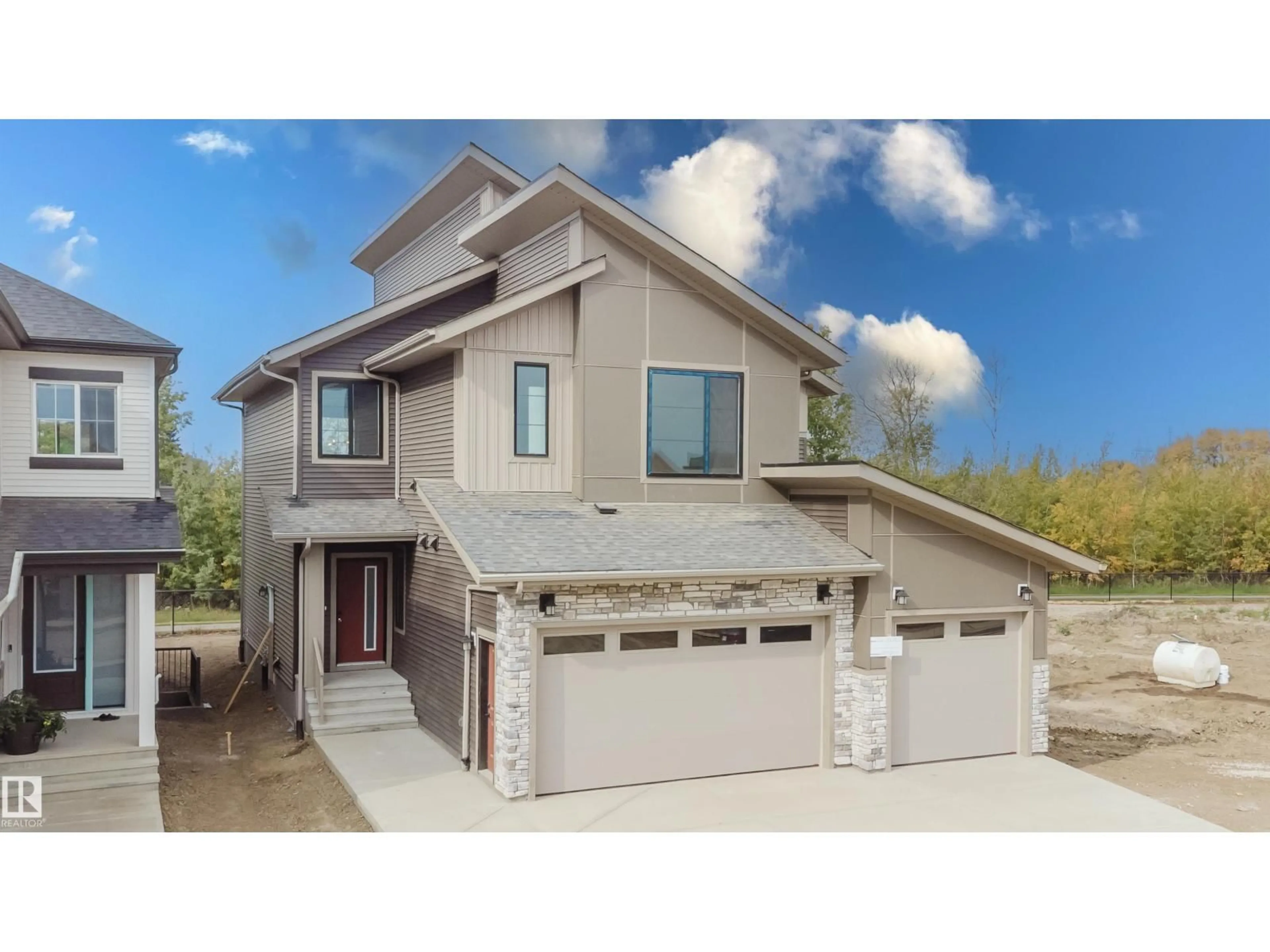 Home with vinyl exterior material, street for NW - 2512 213 ST, Edmonton Alberta T6M3H3