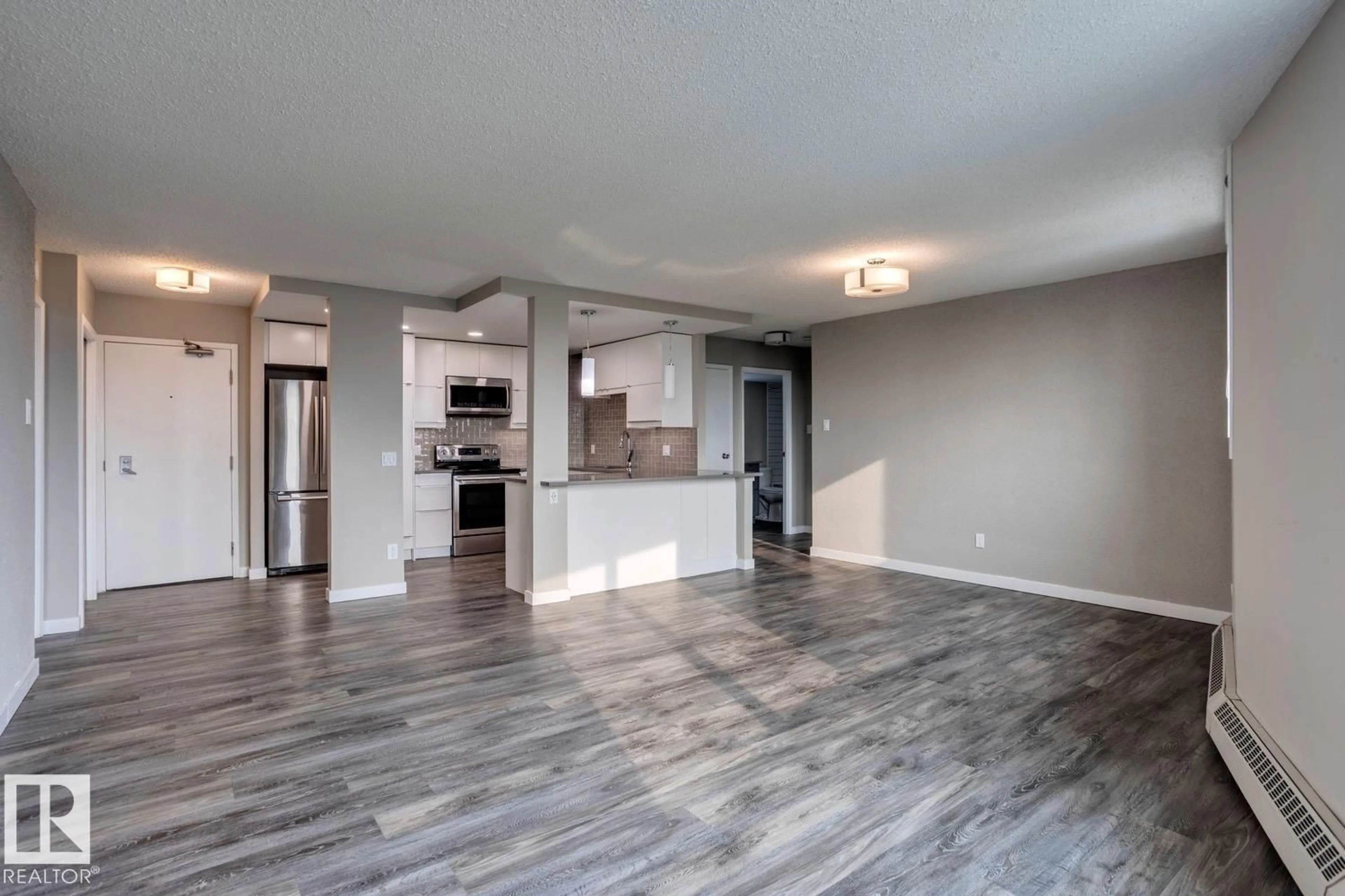 Open concept kitchen, wood/laminate floor for 1702 113 ST NW, Edmonton Alberta T5K2N3