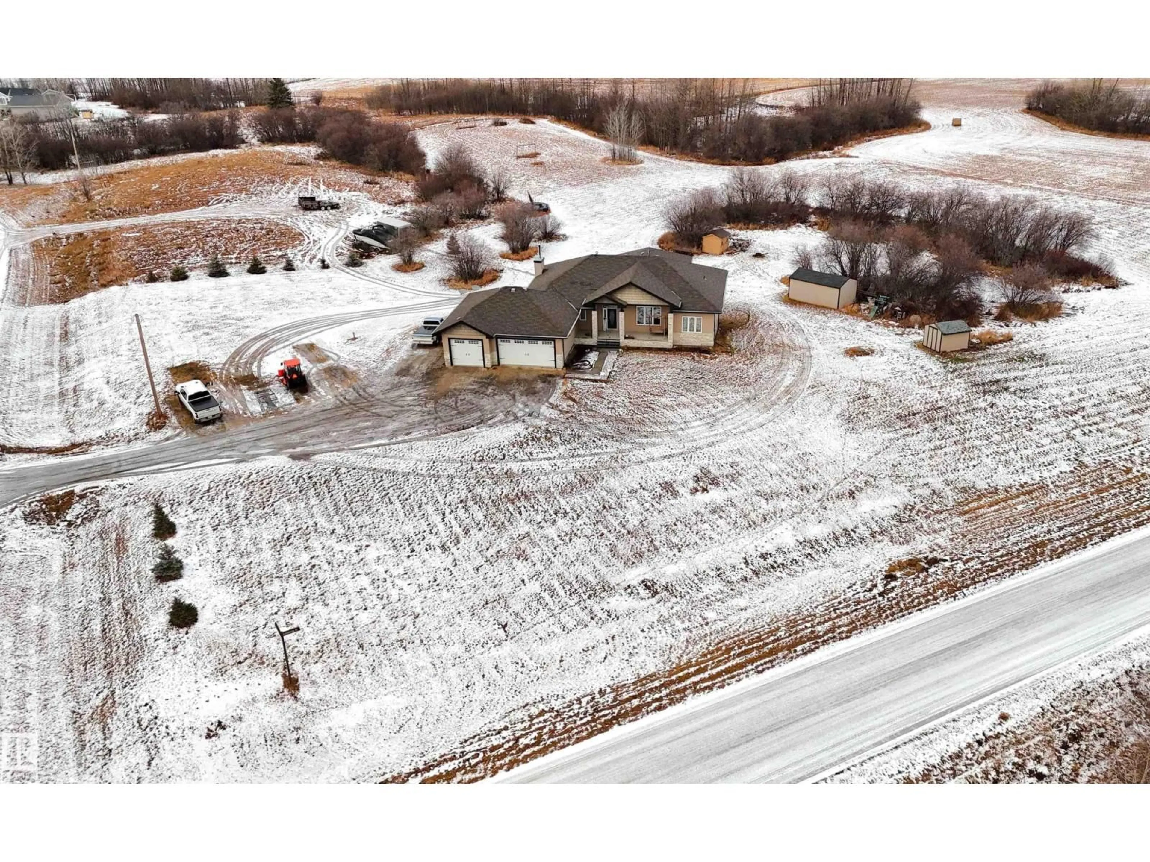 A pic from outside/outdoor area/front of a property/back of a property/a pic from drone, building for 2A - 1319 TWP RD 510, Rural Parkland County Alberta T7Y2N2