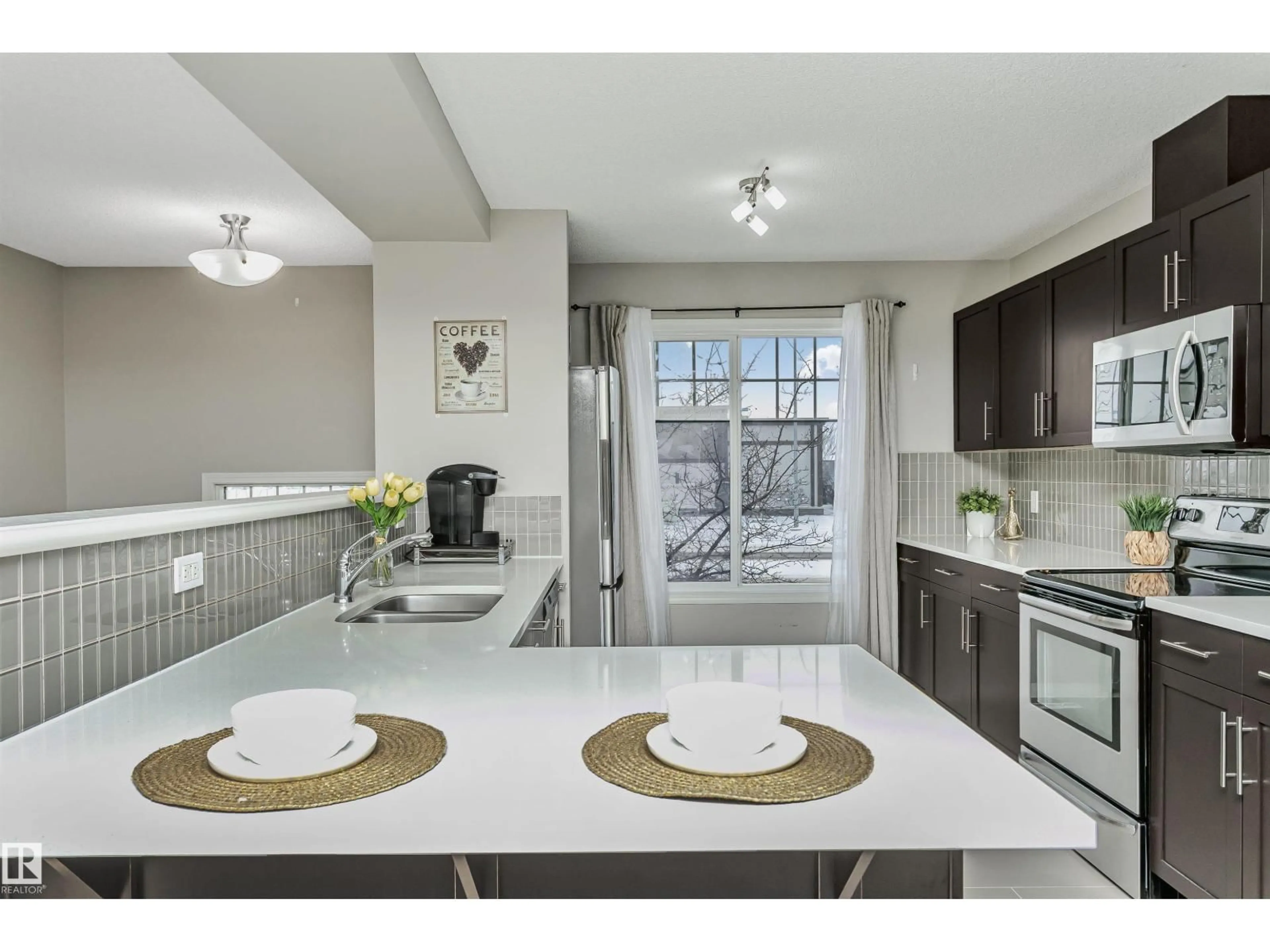 Open concept kitchen, ceramic/tile floor for 460 - 38 HEMINGWY RD, Edmonton Alberta T6M0M5