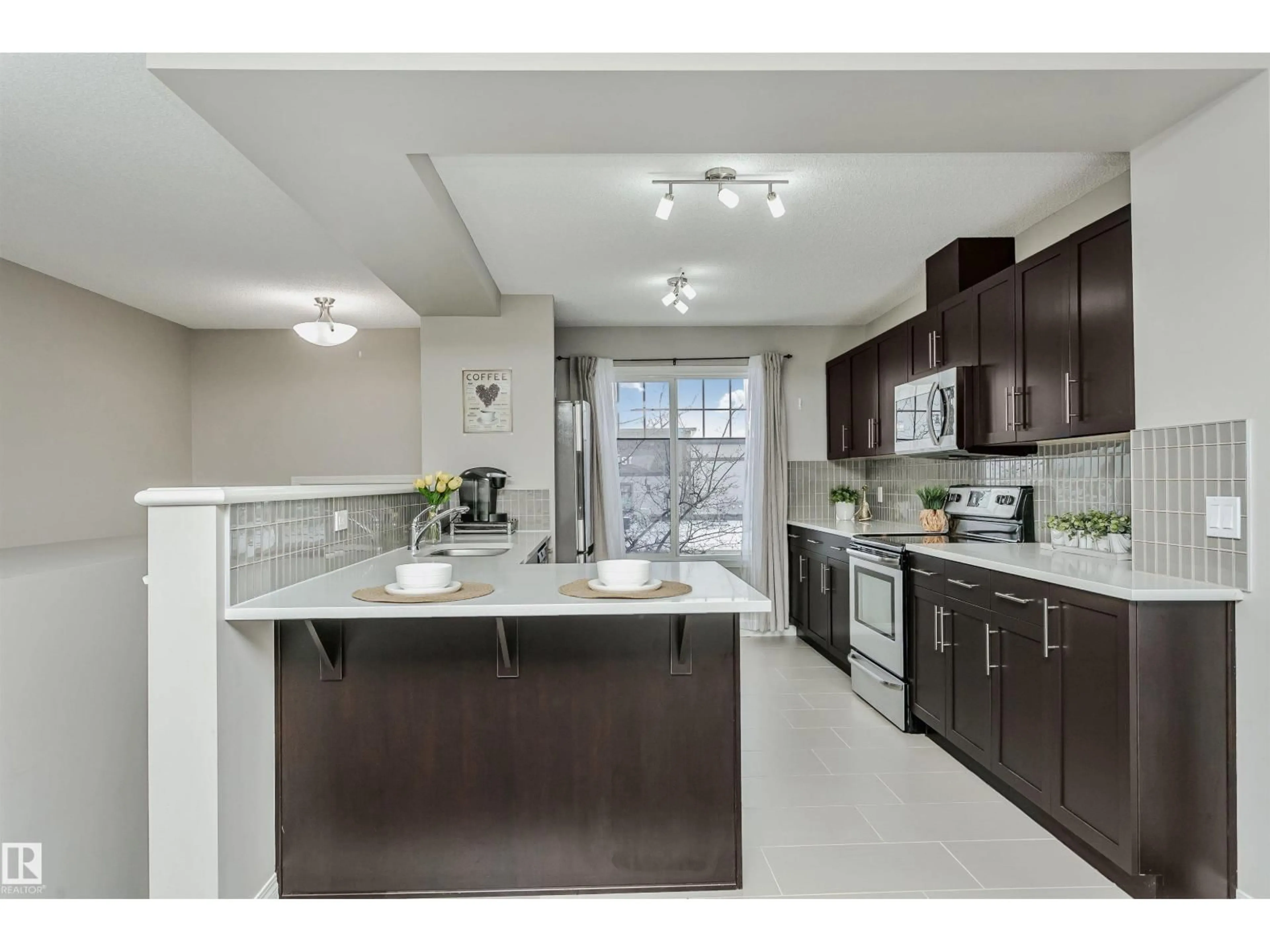 Open concept kitchen, ceramic/tile floor for 460 - 38 HEMINGWY RD, Edmonton Alberta T6M0M5