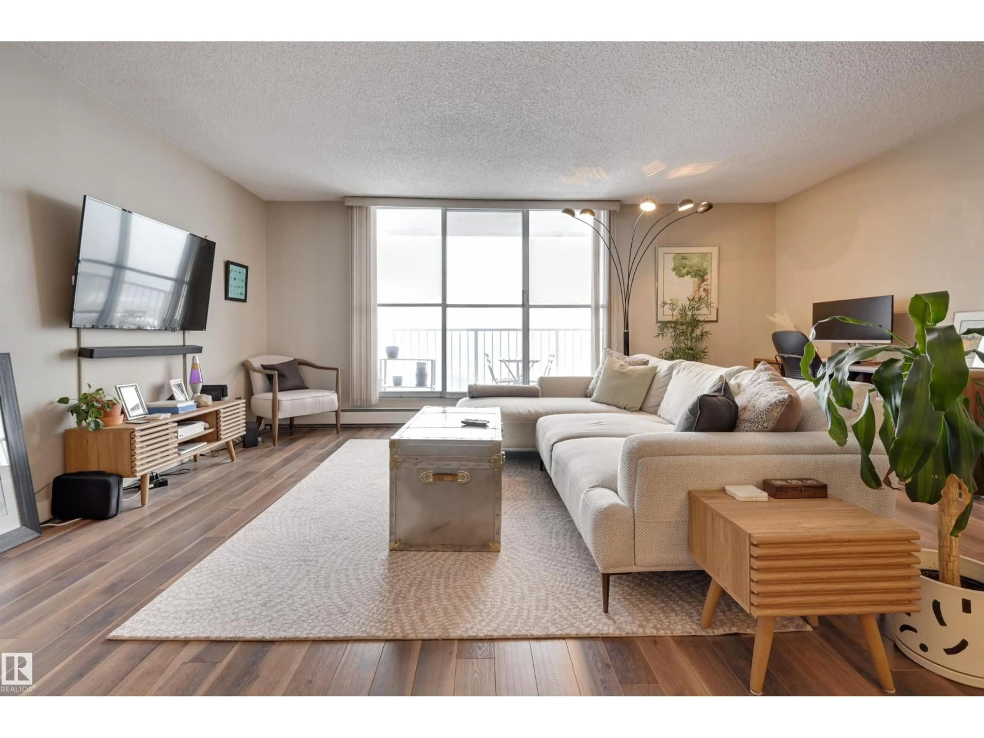 Living room with furniture, wood/laminate floor for #406 - 12141 JASPER AV, Edmonton Alberta T5N3X8