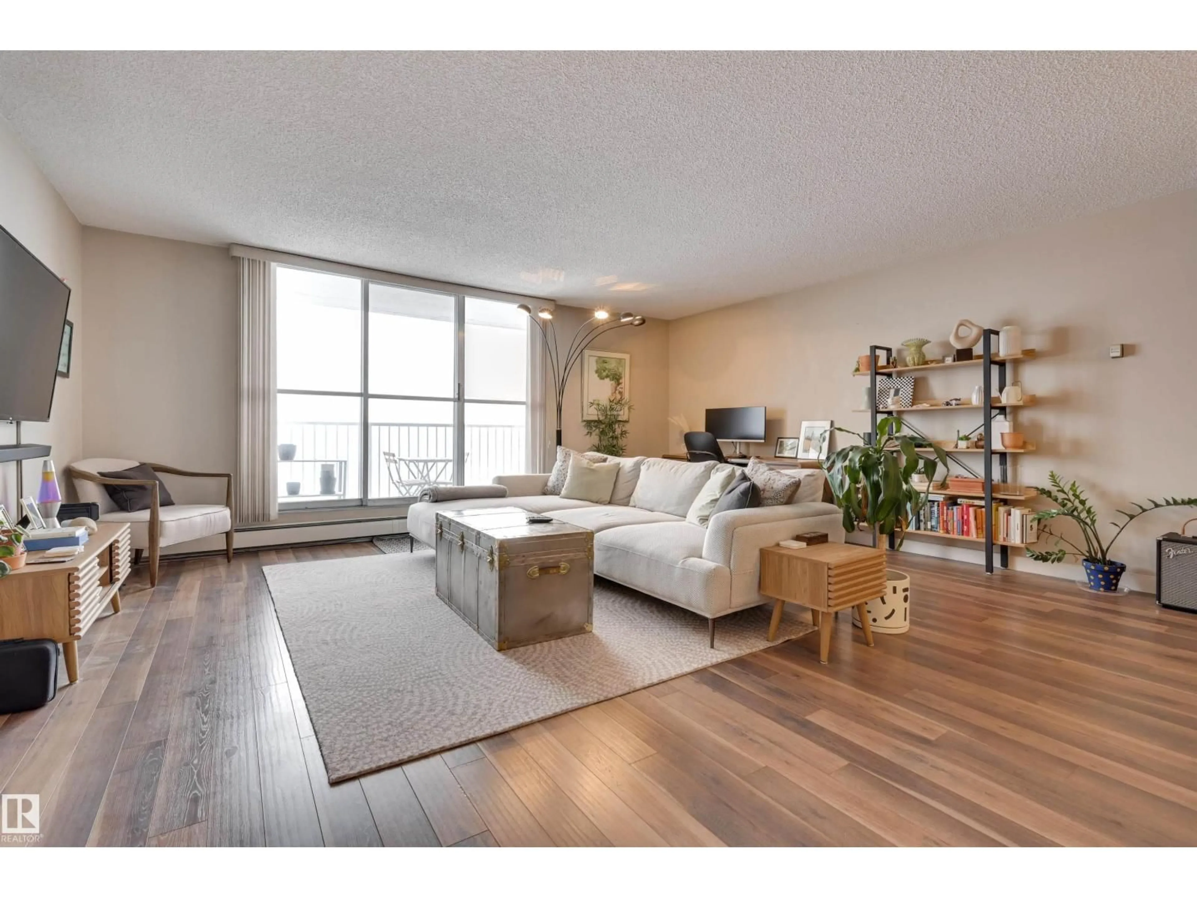 Living room with furniture, wood/laminate floor for #406 - 12141 JASPER AV, Edmonton Alberta T5N3X8