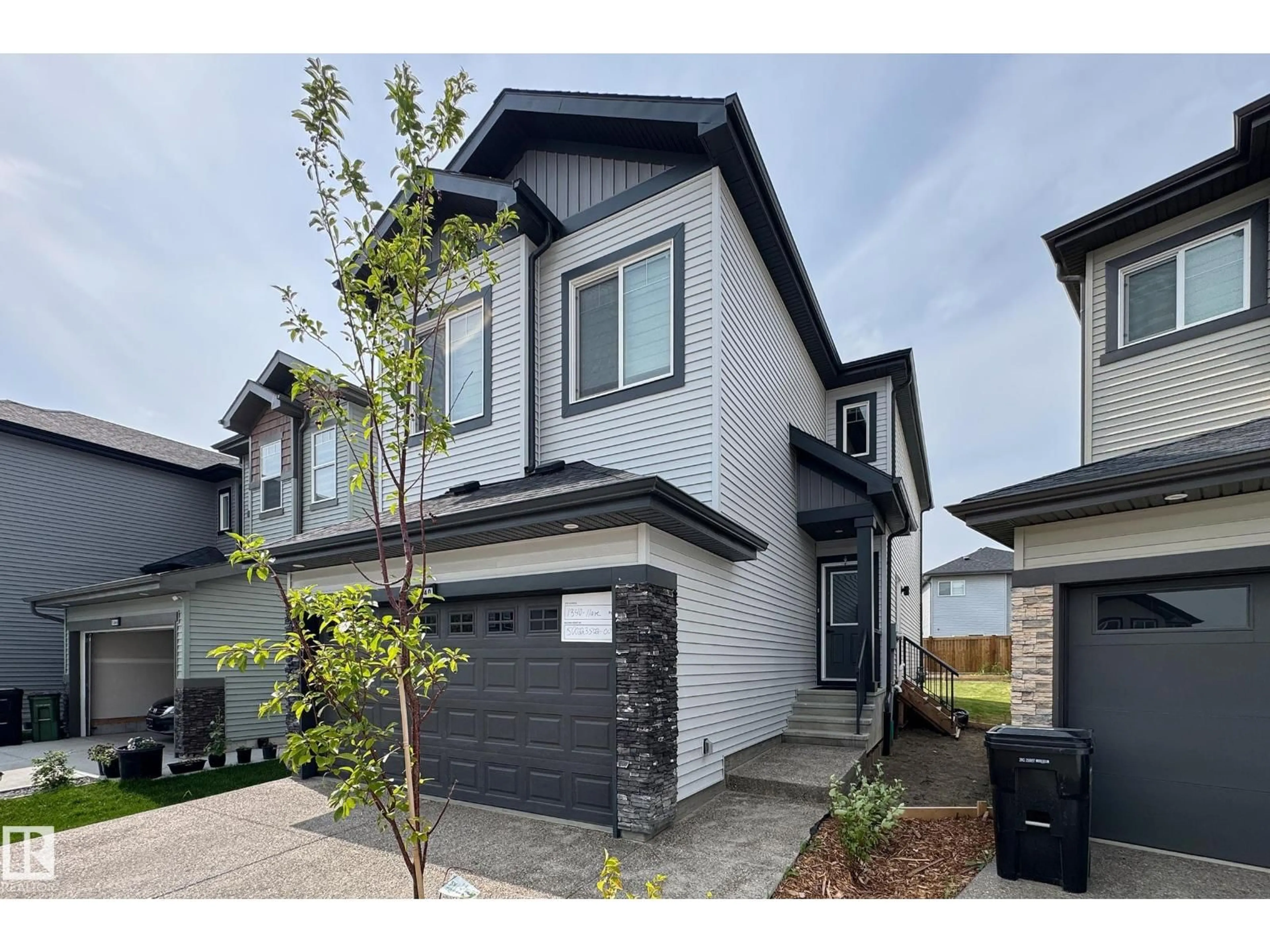 Home with vinyl exterior material, street for NW - 1340 11 AV, Edmonton Alberta T6T2W4