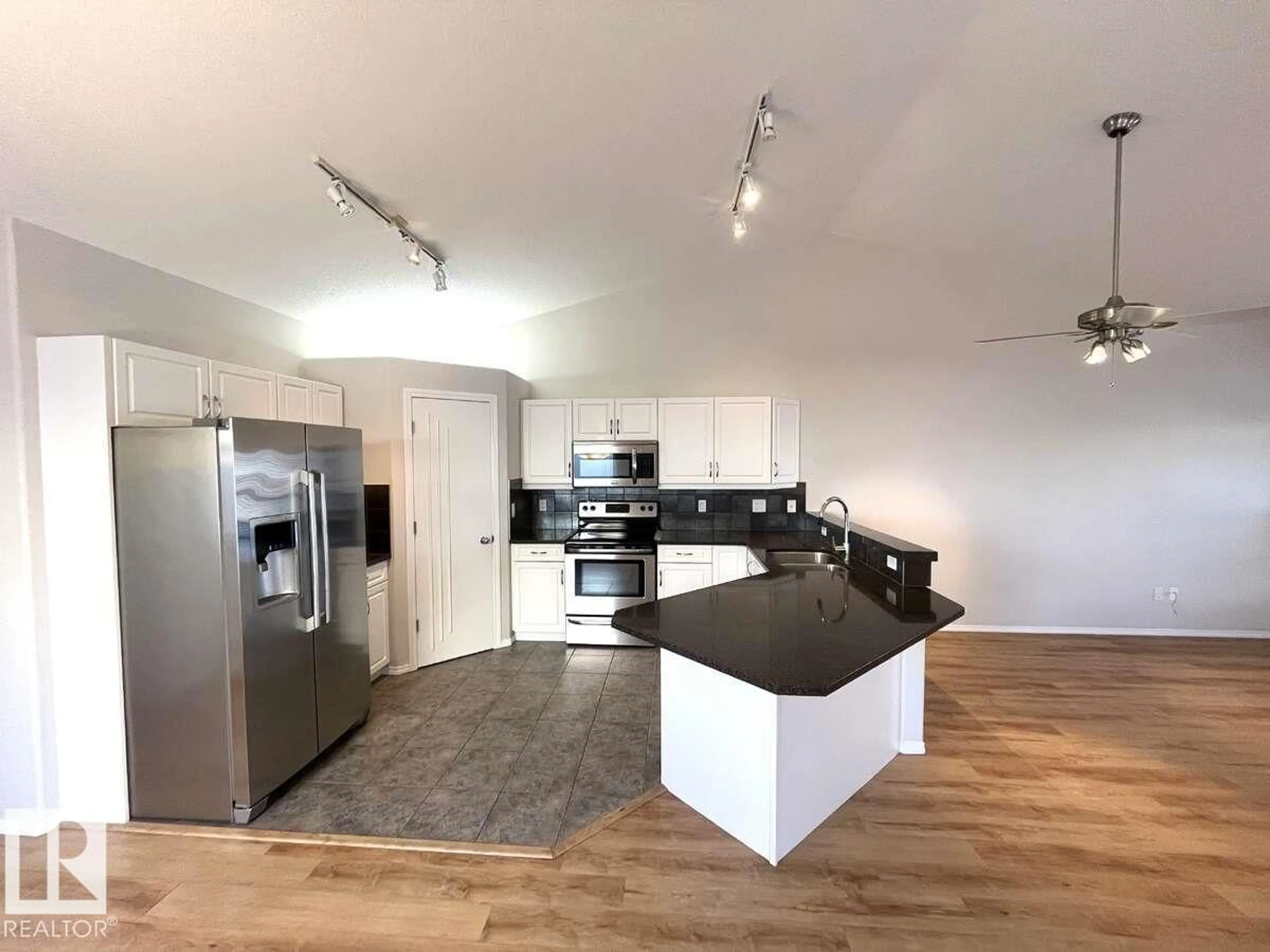 Open concept kitchen, wood/laminate floor for 303 - 12 LEGER WY, Edmonton Alberta T6R2X9