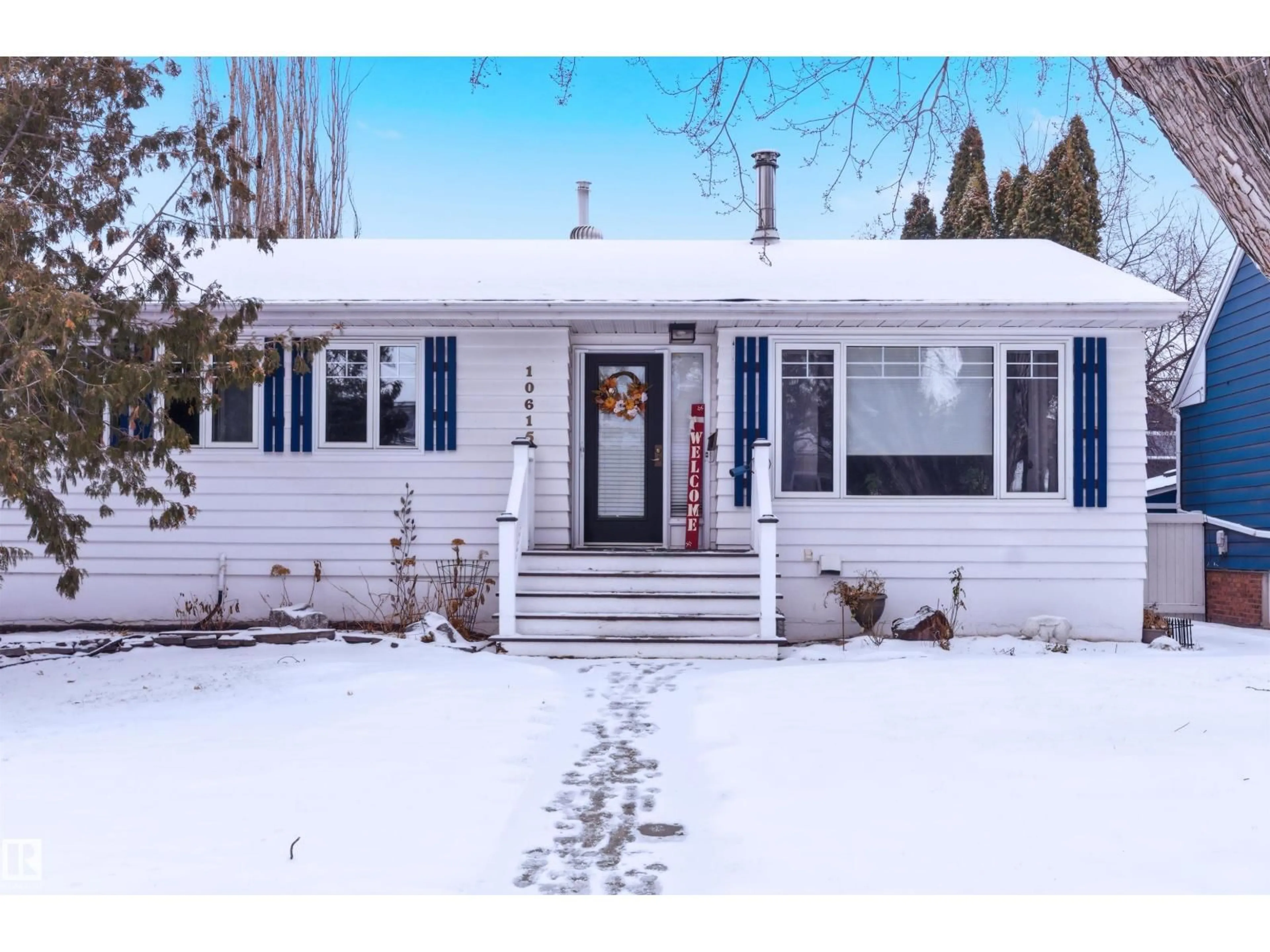 Home with vinyl exterior material, street for 10615 134 ST, Edmonton Alberta T5N2B7