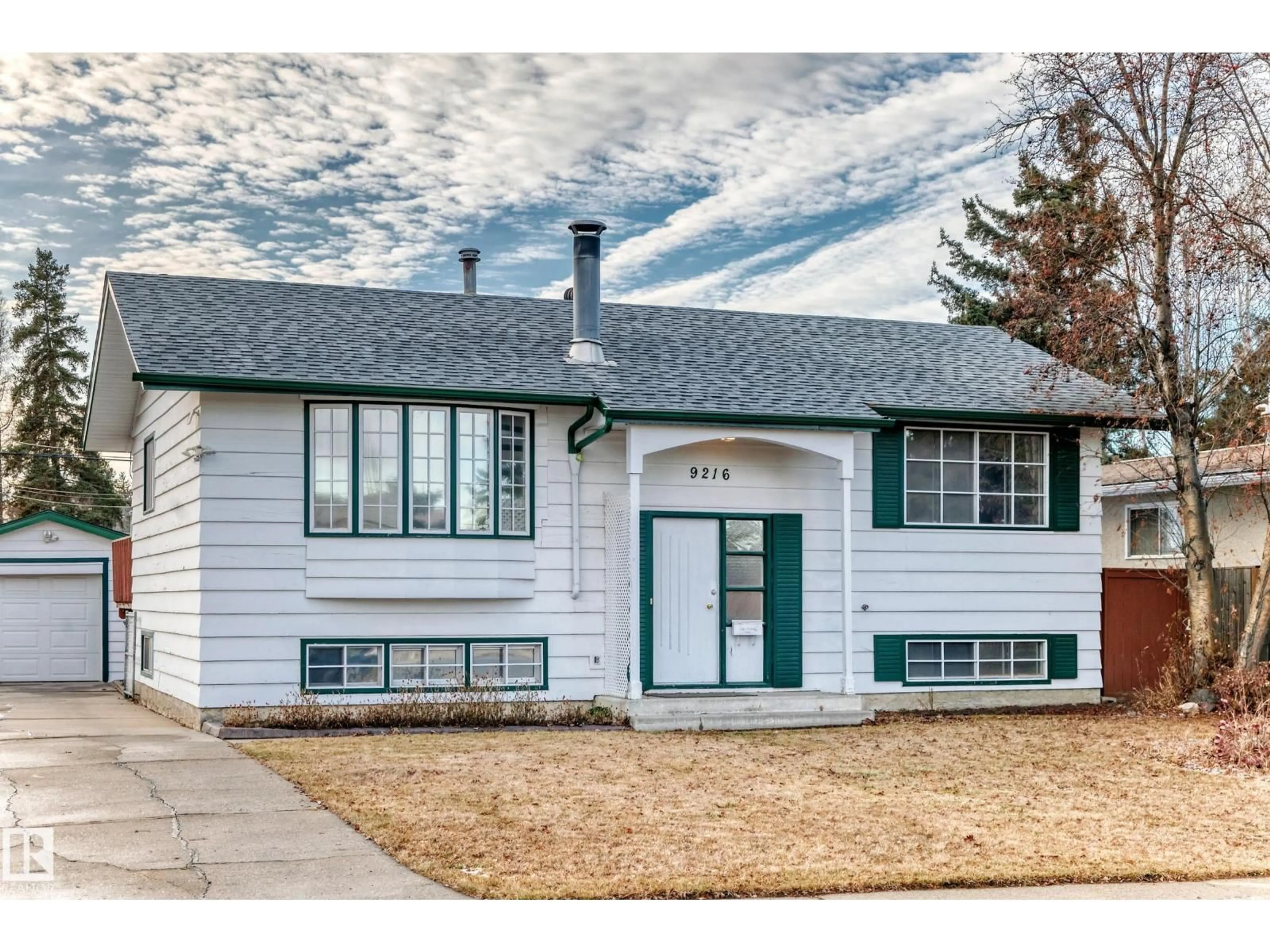 Home with vinyl exterior material, street for 9216 68 ST, Edmonton Alberta T6B1S6