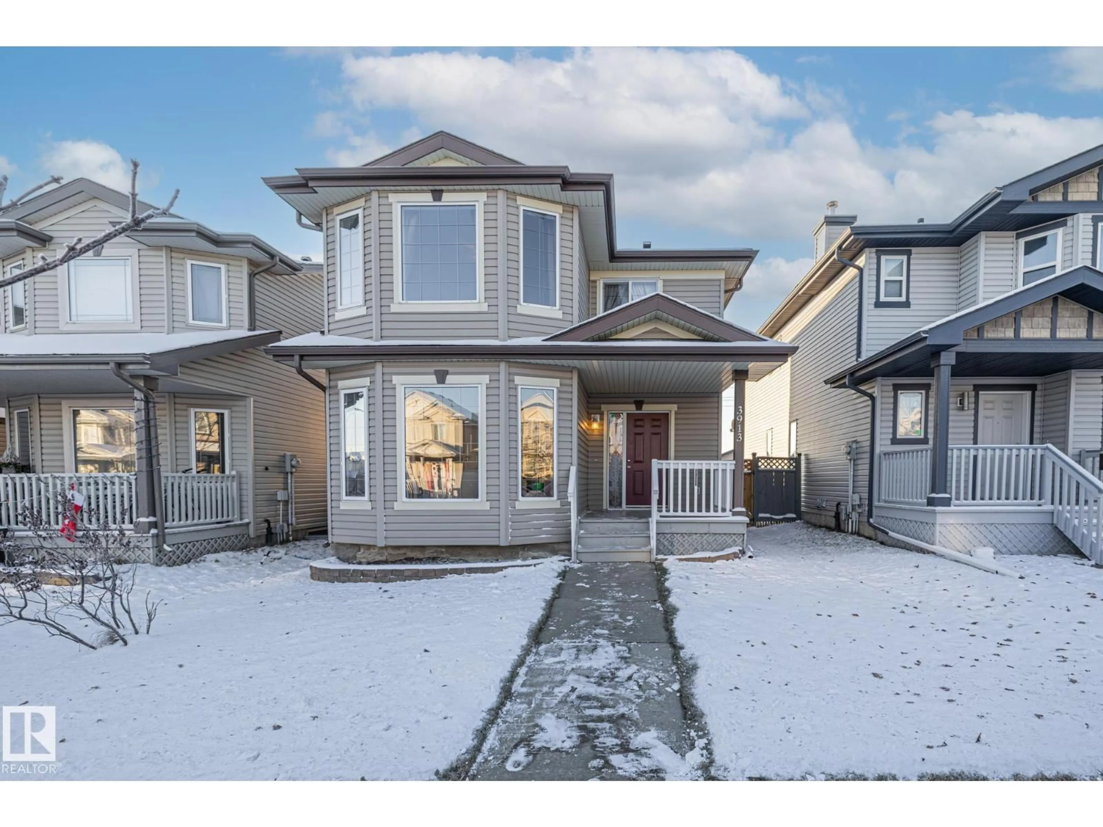 Home with vinyl exterior material, street for NW - 3913 159 AV, Edmonton Alberta T5Y3J9