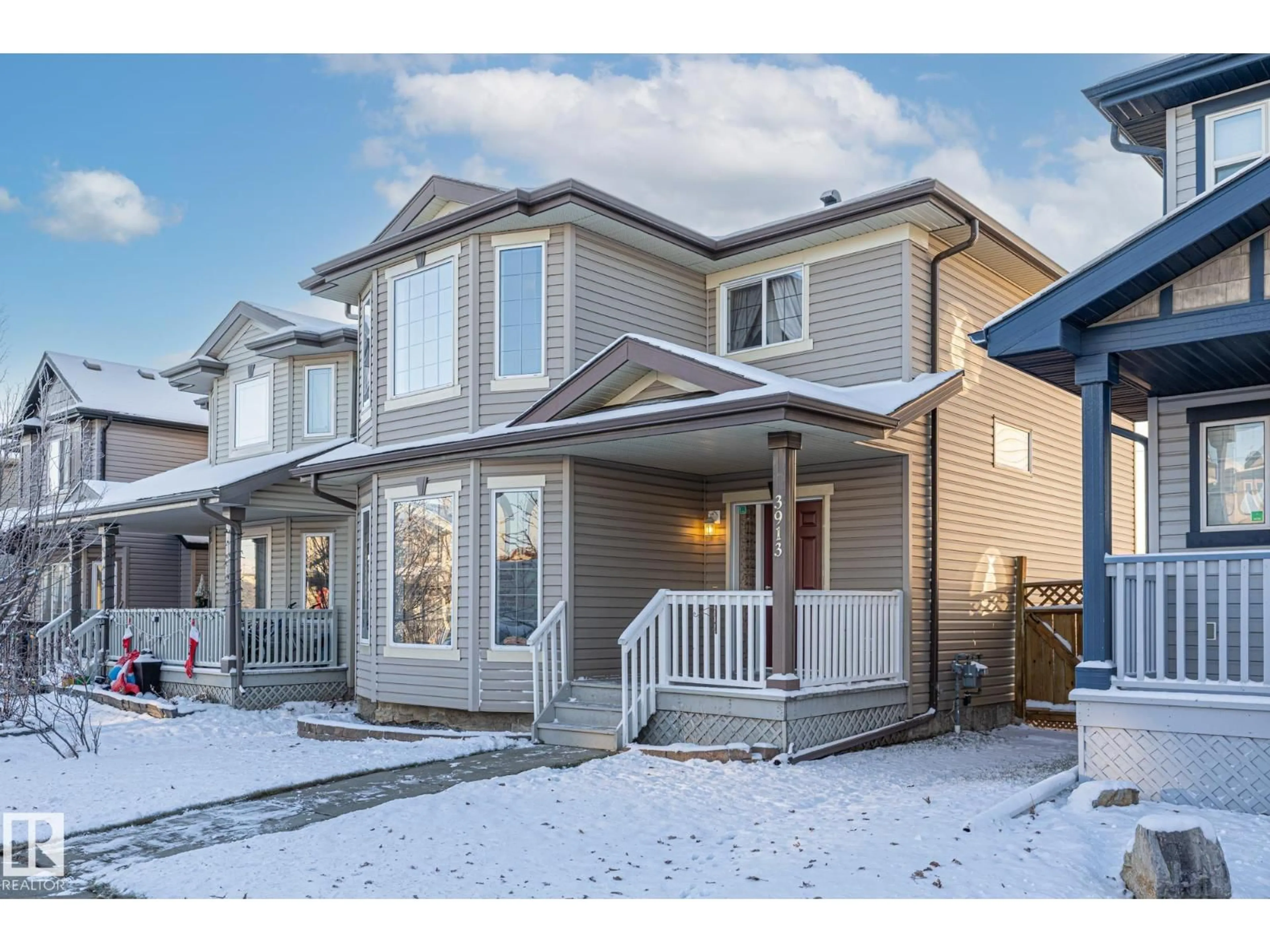 Home with vinyl exterior material, street for NW - 3913 159 AV, Edmonton Alberta T5Y3J9