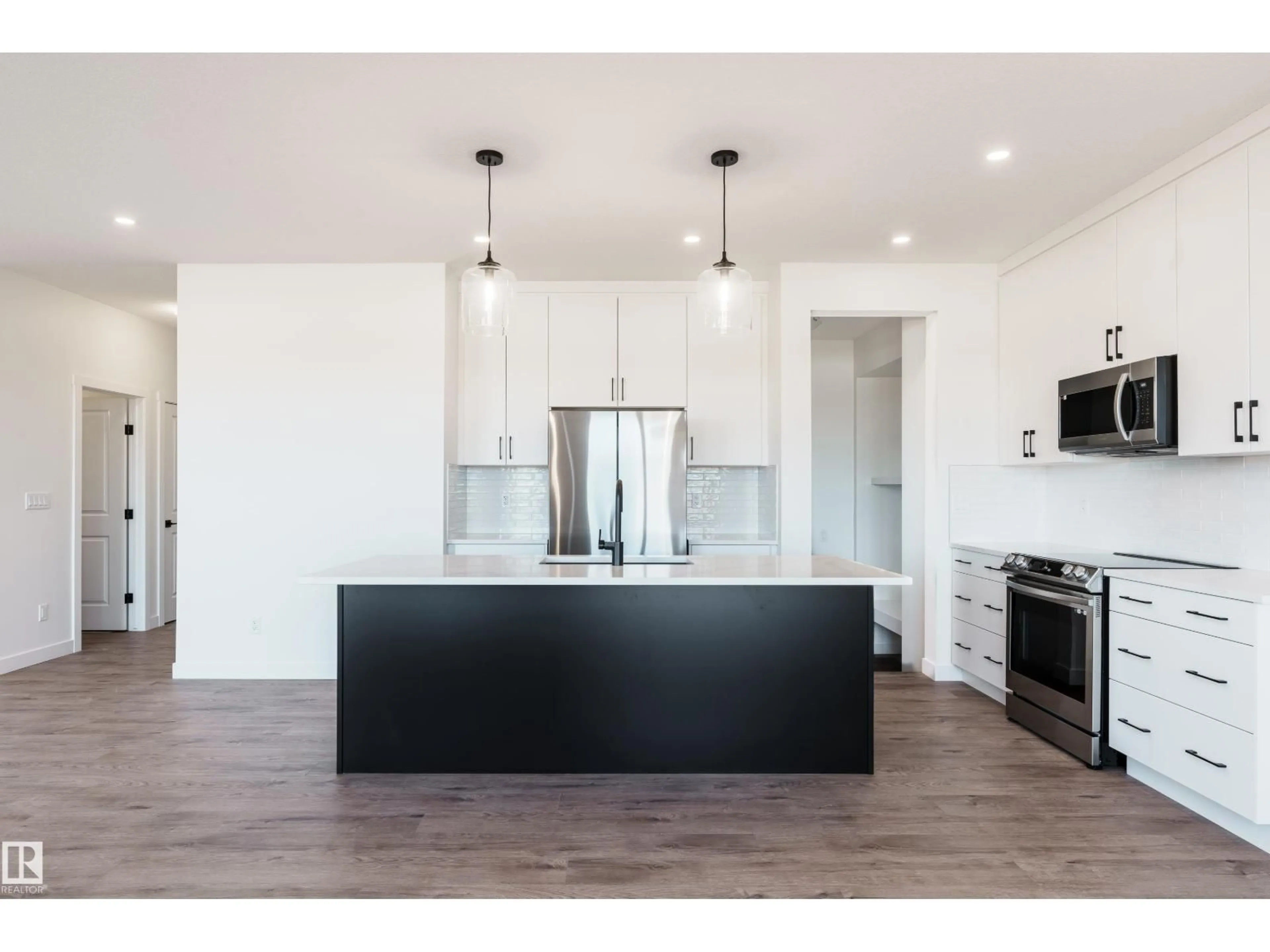 Open concept kitchen, wood/laminate floor for 1057 CORNERSTONE WY, Sherwood Park Alberta T8H3A3
