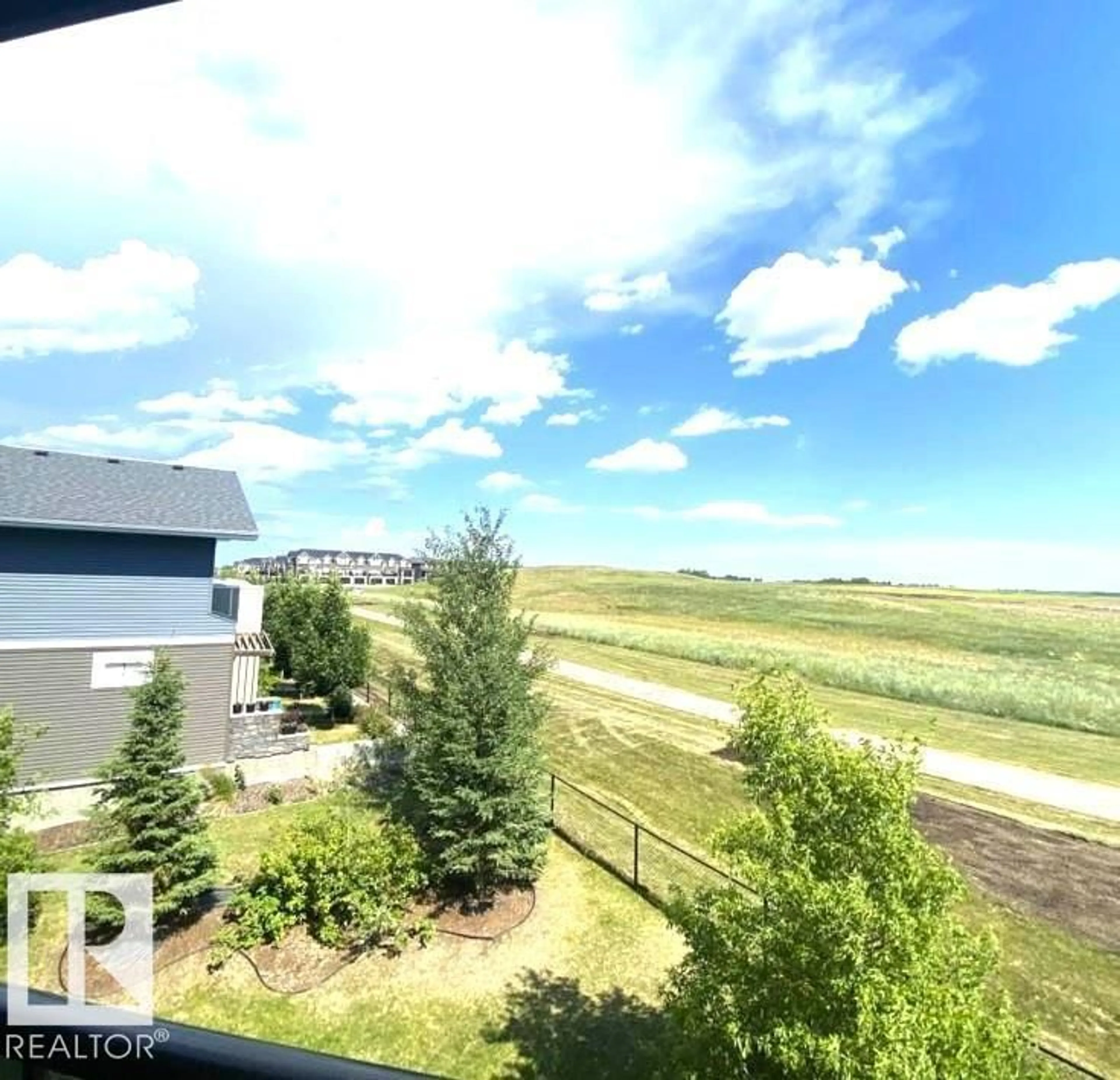 A pic from outside/outdoor area/front of a property/back of a property/a pic from drone, water/lake/river/ocean view for #313 - 1510 WATT DR, Edmonton Alberta T6X2E6