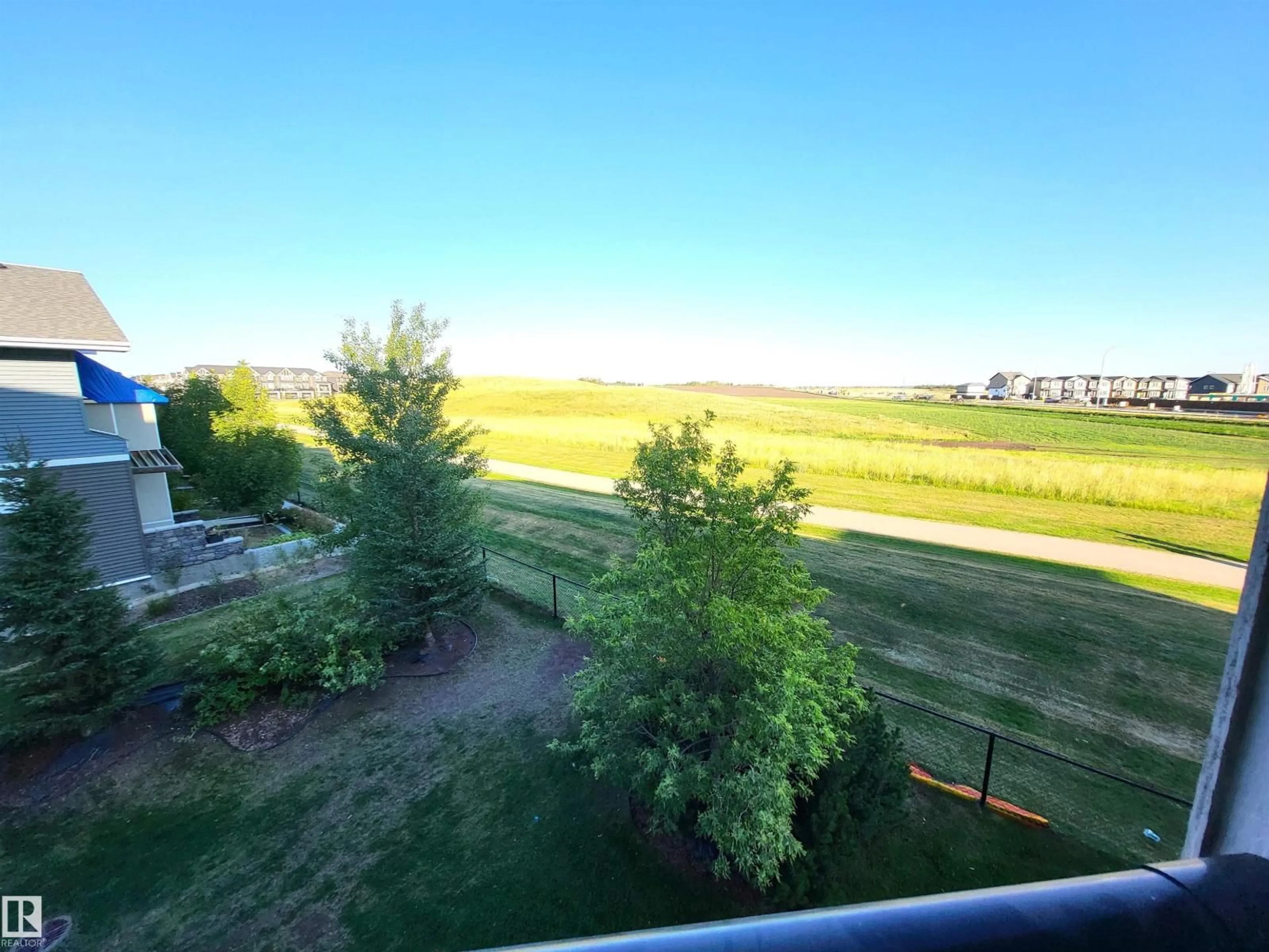 A pic from outside/outdoor area/front of a property/back of a property/a pic from drone, water/lake/river/ocean view for #313 - 1510 WATT DR, Edmonton Alberta T6X2E6