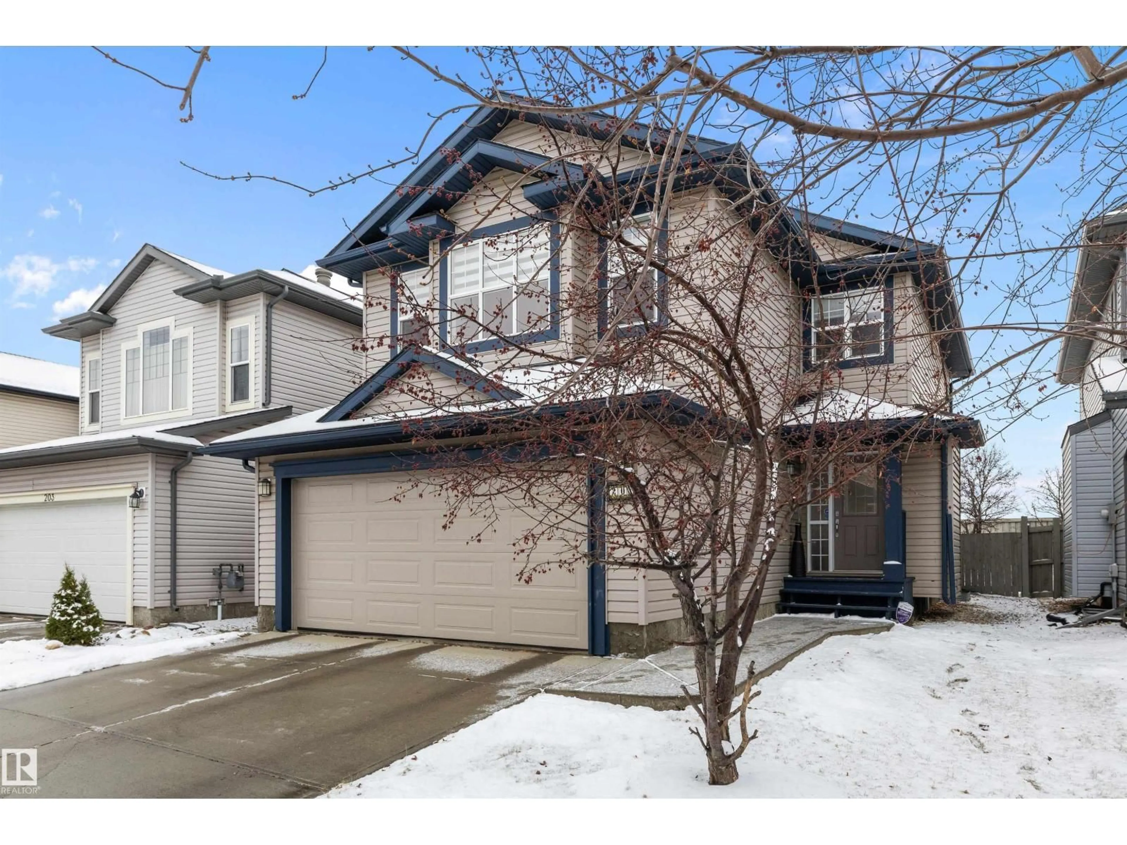 Home with vinyl exterior material, street for 205 MACEWAN RD, Edmonton Alberta T6W1R2