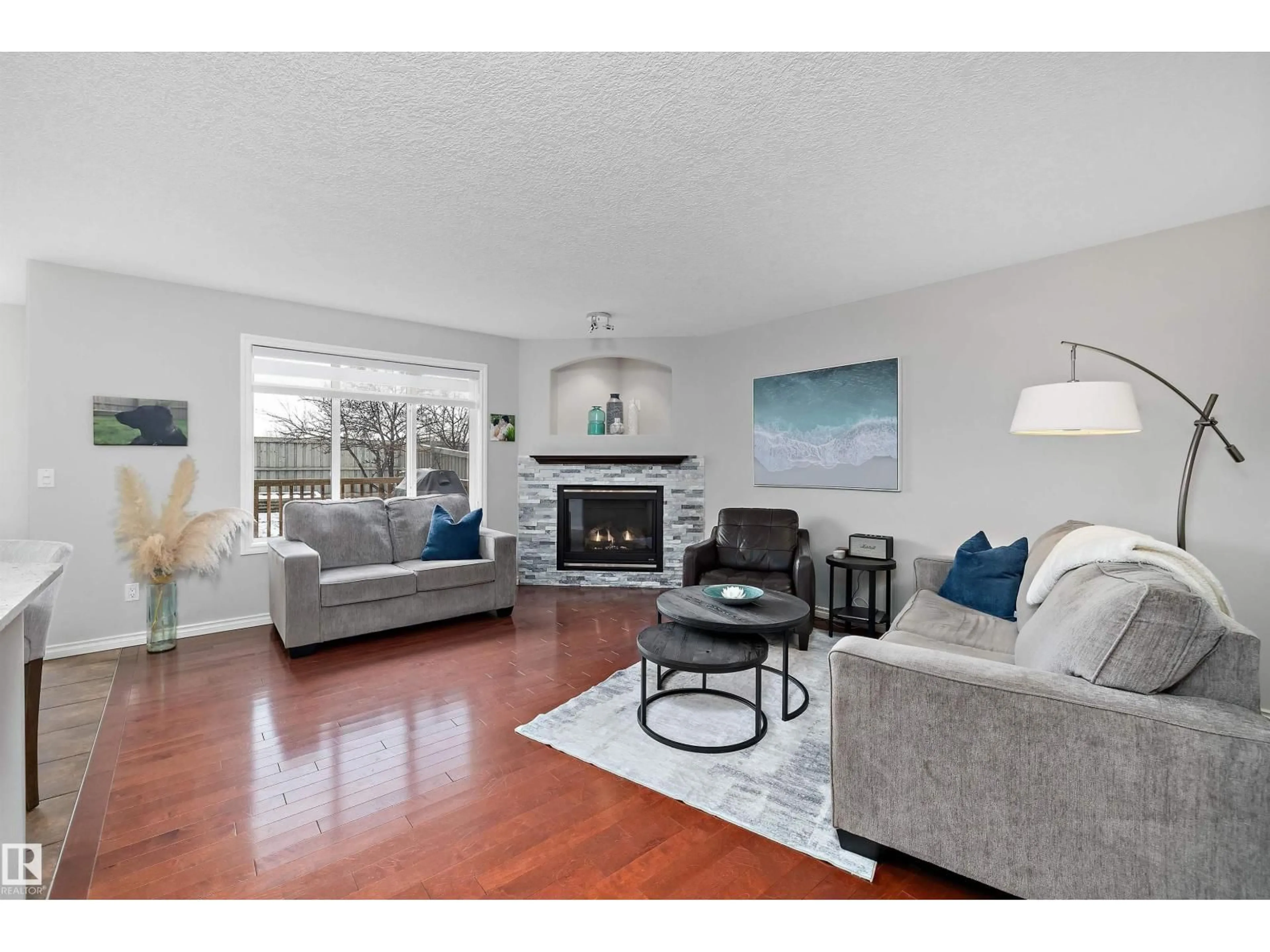 Living room with furniture, wood/laminate floor for 205 MACEWAN RD, Edmonton Alberta T6W1R2