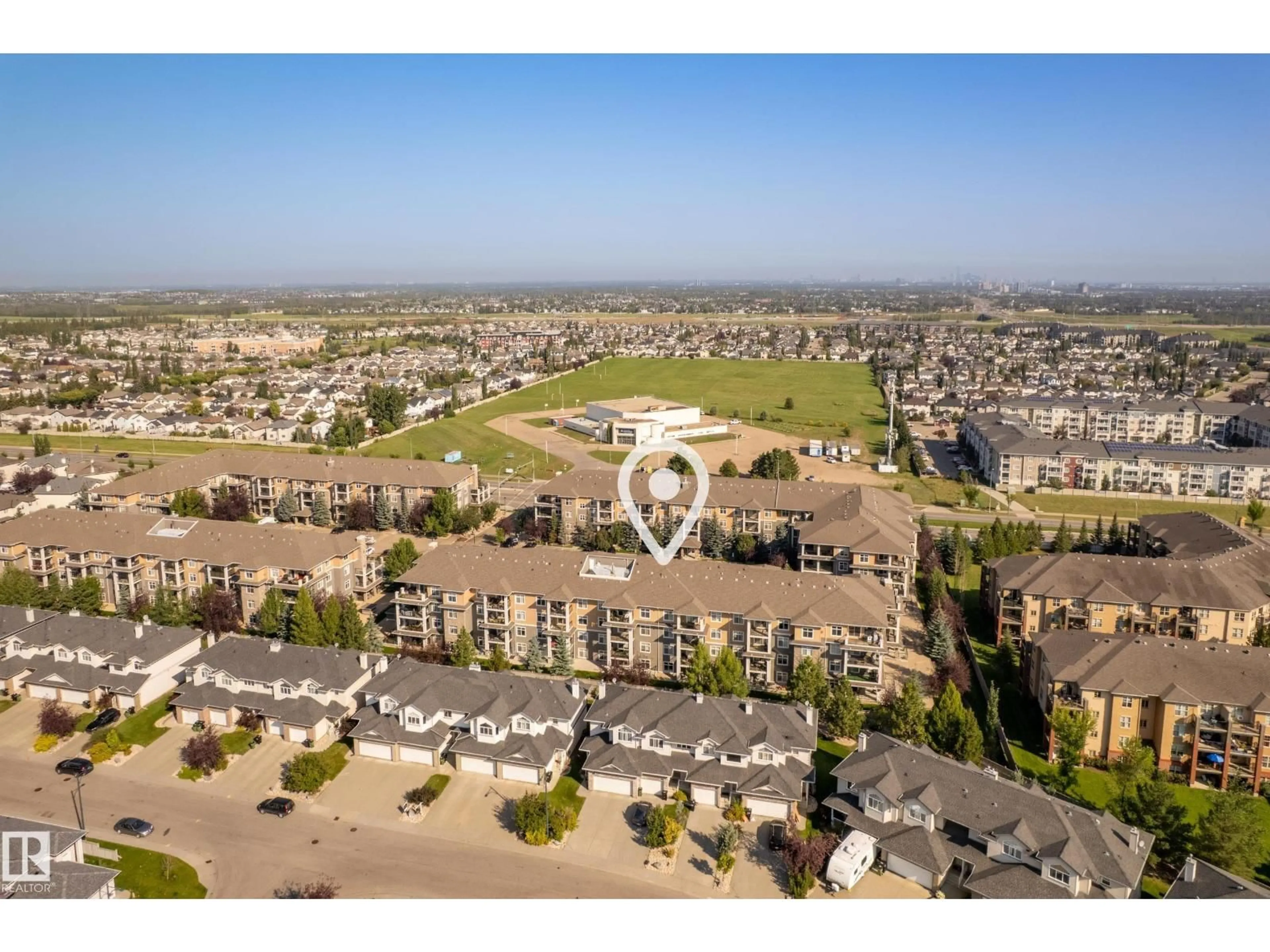 A pic from outside/outdoor area/front of a property/back of a property/a pic from drone, mountain view for 11505 ELLERSLIE RD, Edmonton Alberta T6W2A9