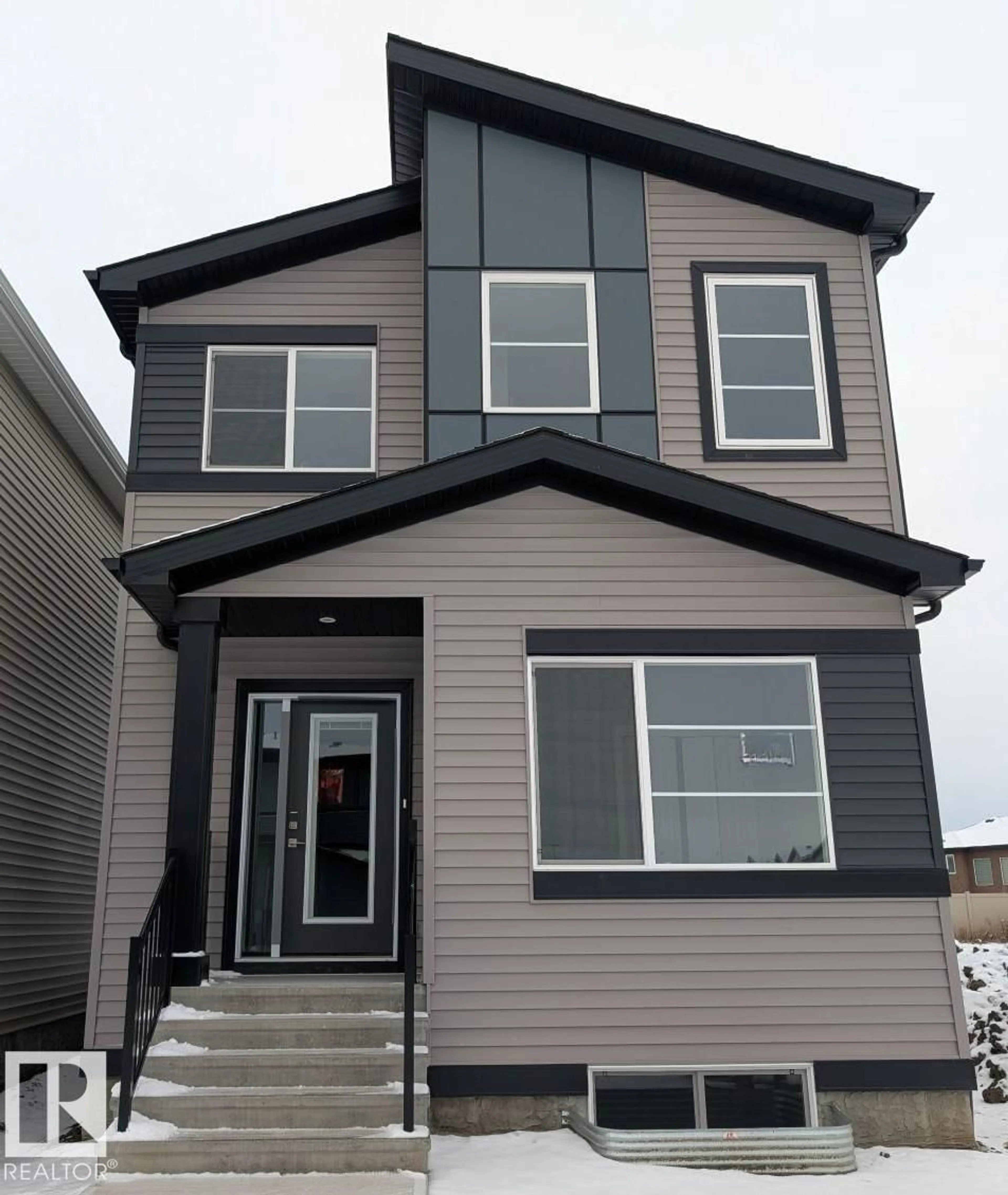 Home with vinyl exterior material, street for 7379 181 AV, Edmonton Alberta T5Z0J1