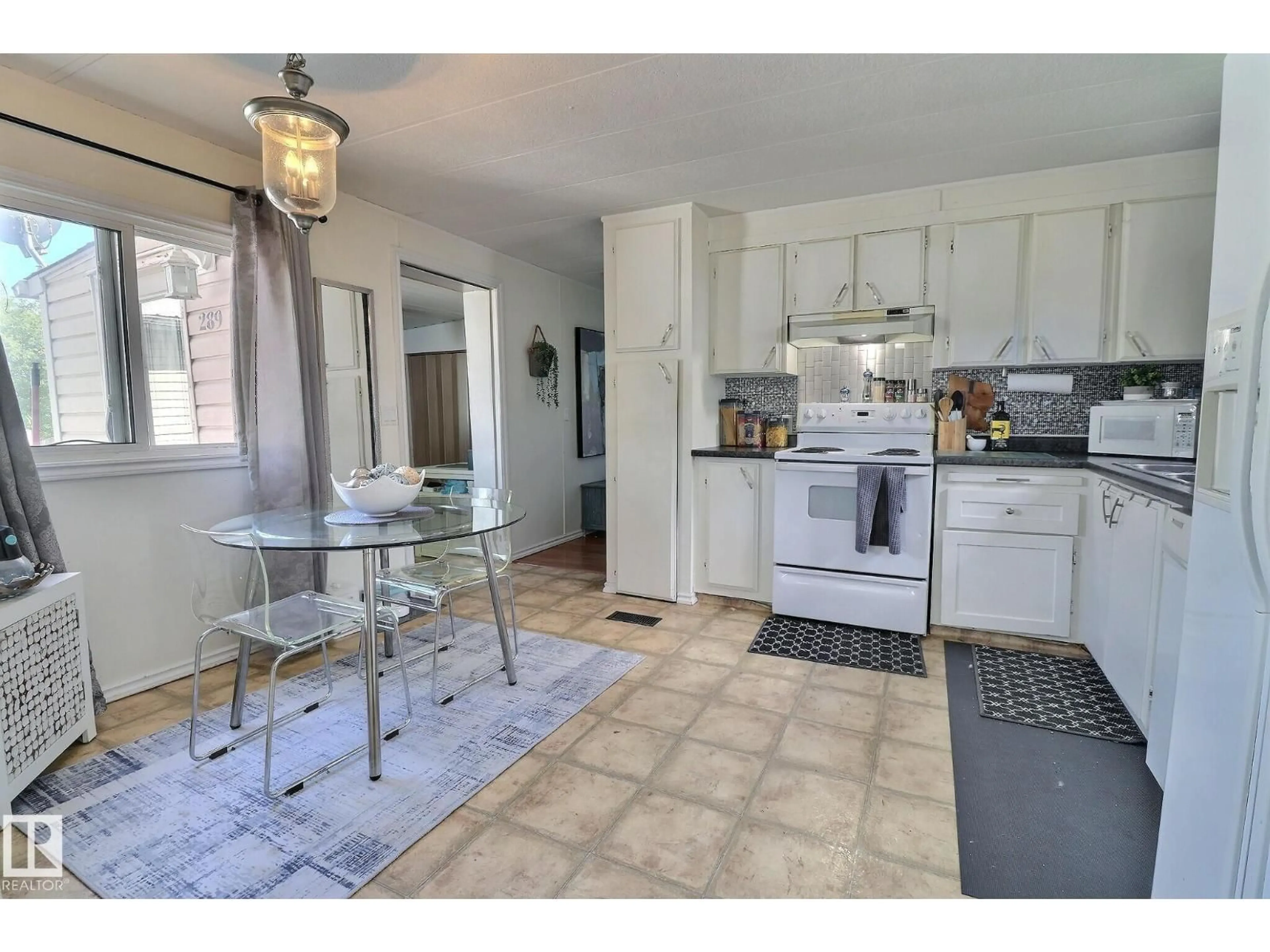 Open concept kitchen, ceramic/tile floor for 289 JUNIPER CR, Edmonton Alberta T5Y6L6