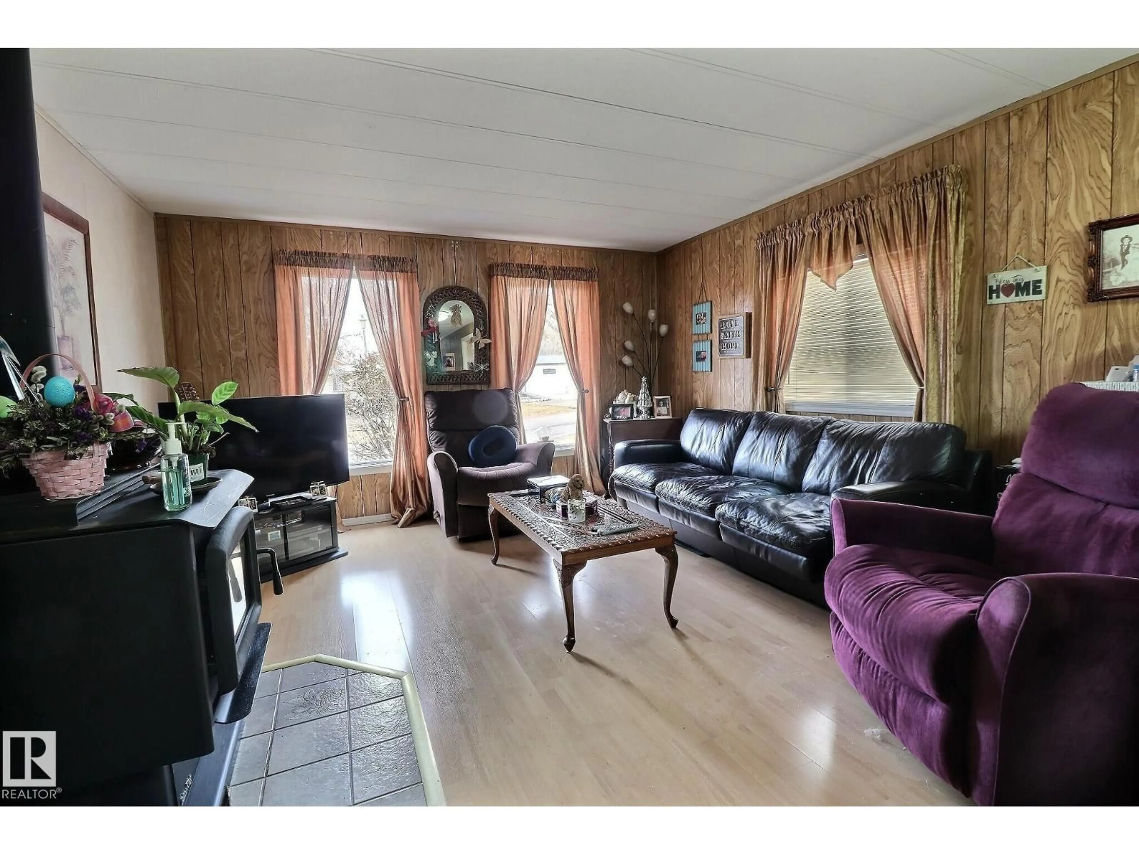 Living room with furniture, wood/laminate floor for 290 JUNIPER CR, Edmonton Alberta T5Y6L6