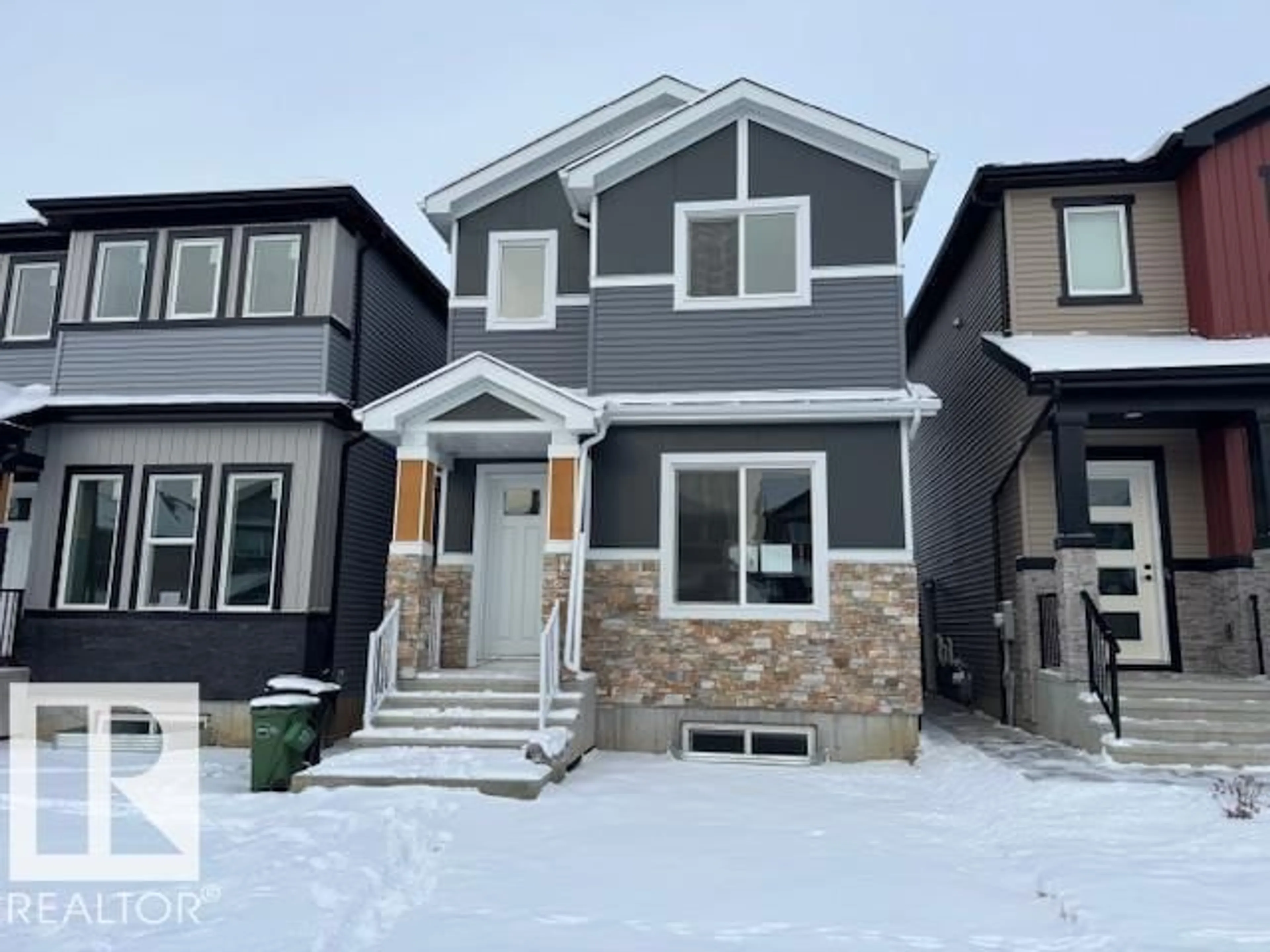 Home with vinyl exterior material, street for 838 NORTHERN HARRIER LN, Edmonton Alberta T5R2V5
