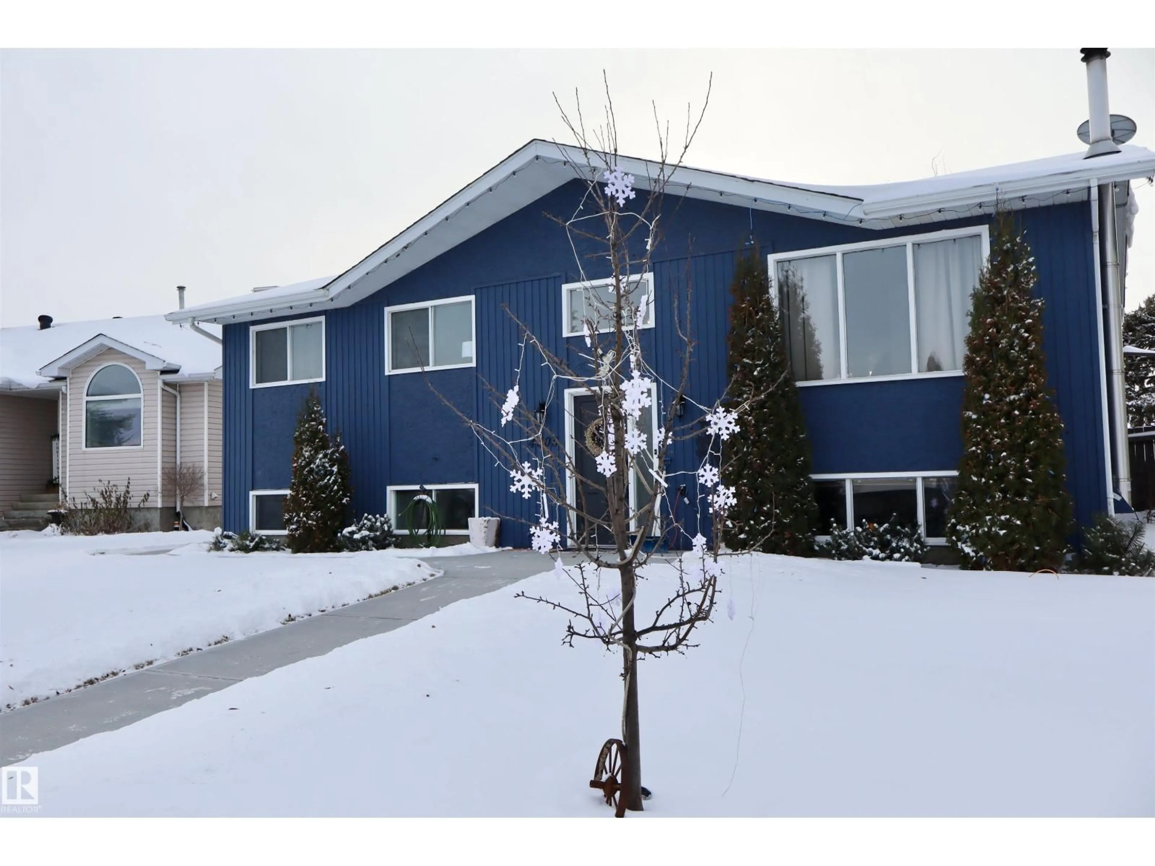 Home with vinyl exterior material, street for 4505 58 AV, Barrhead Alberta T7N1K5