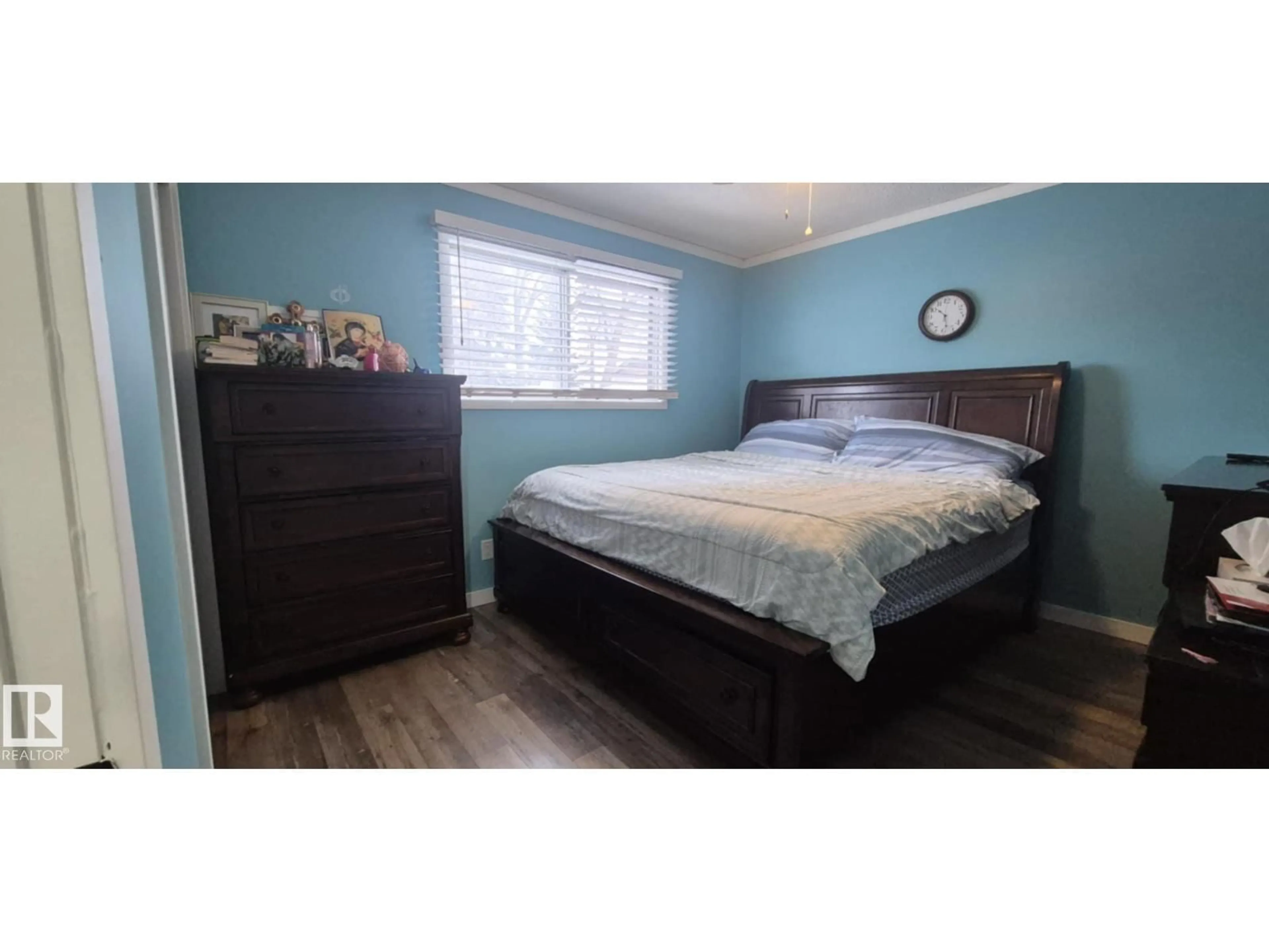 Bedroom with bed, wood/laminate floor for 5420 40 AV, Wetaskiwin Alberta T9A0A5