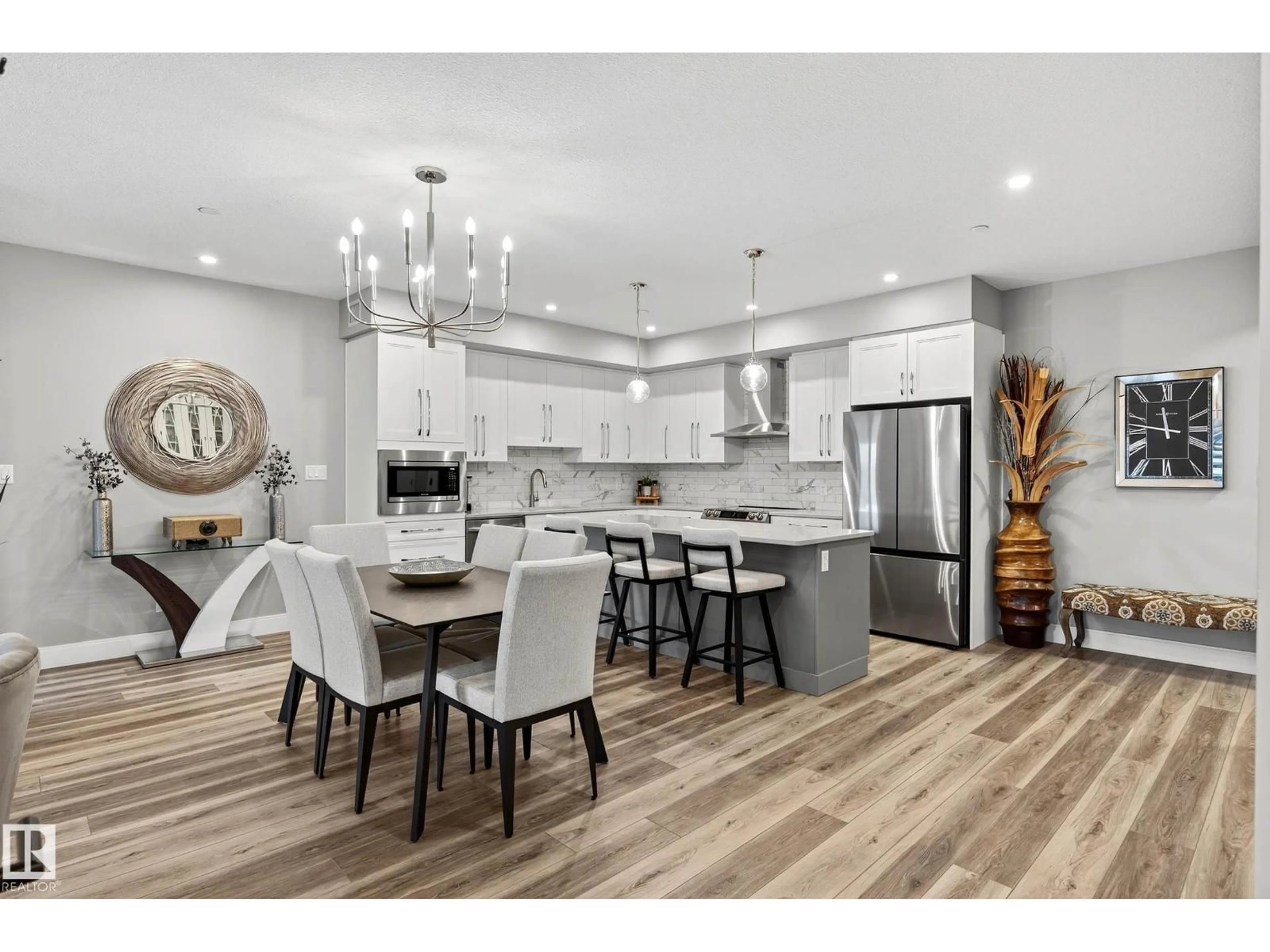 Open concept kitchen, wood/laminate floor for #303 - 7463 MAY CM, Edmonton Alberta T6R0X1