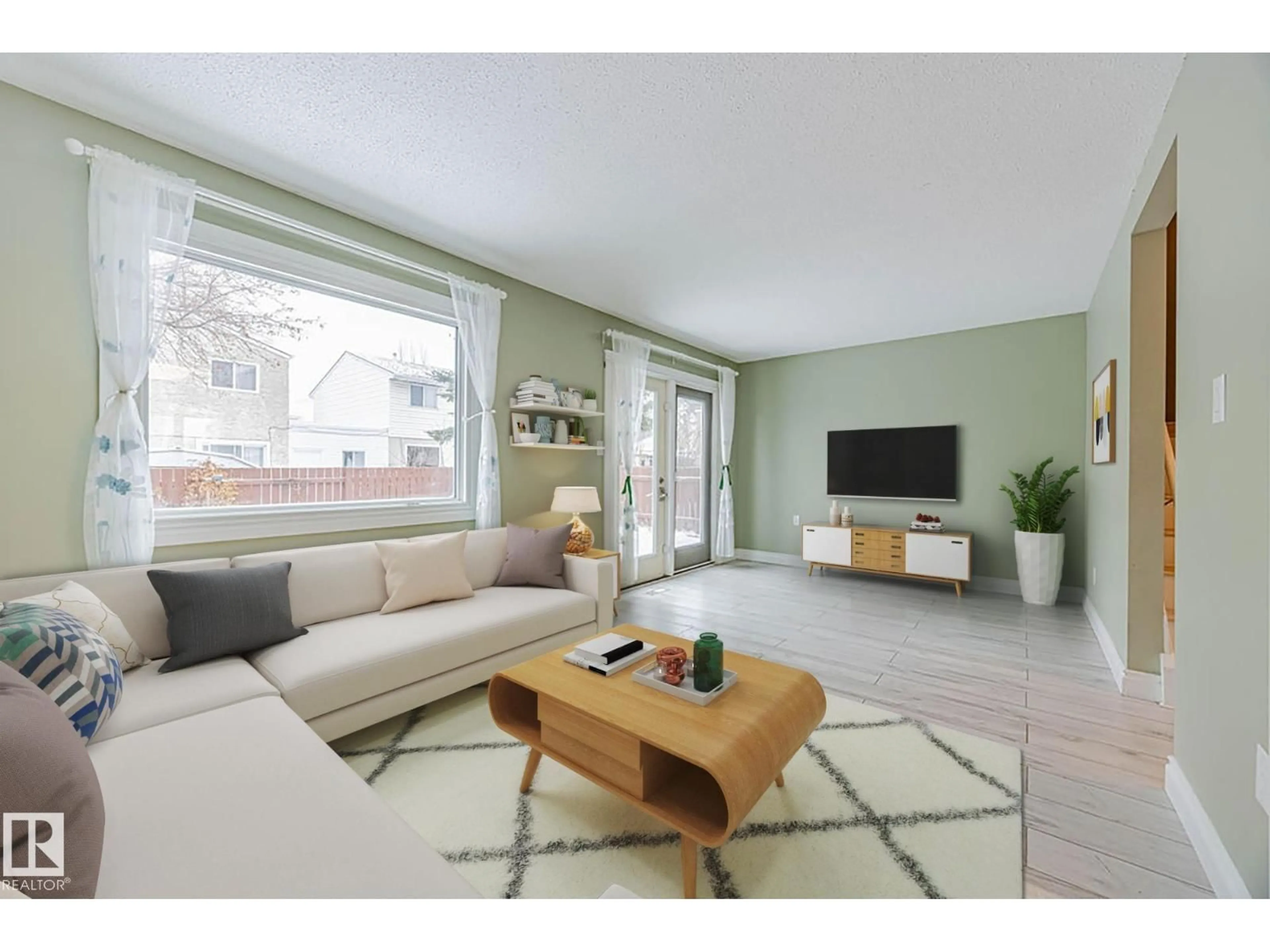 Living room with furniture, wood/laminate floor for 1170 MILLBOURNE RD E NW, Edmonton Alberta T6K1W1