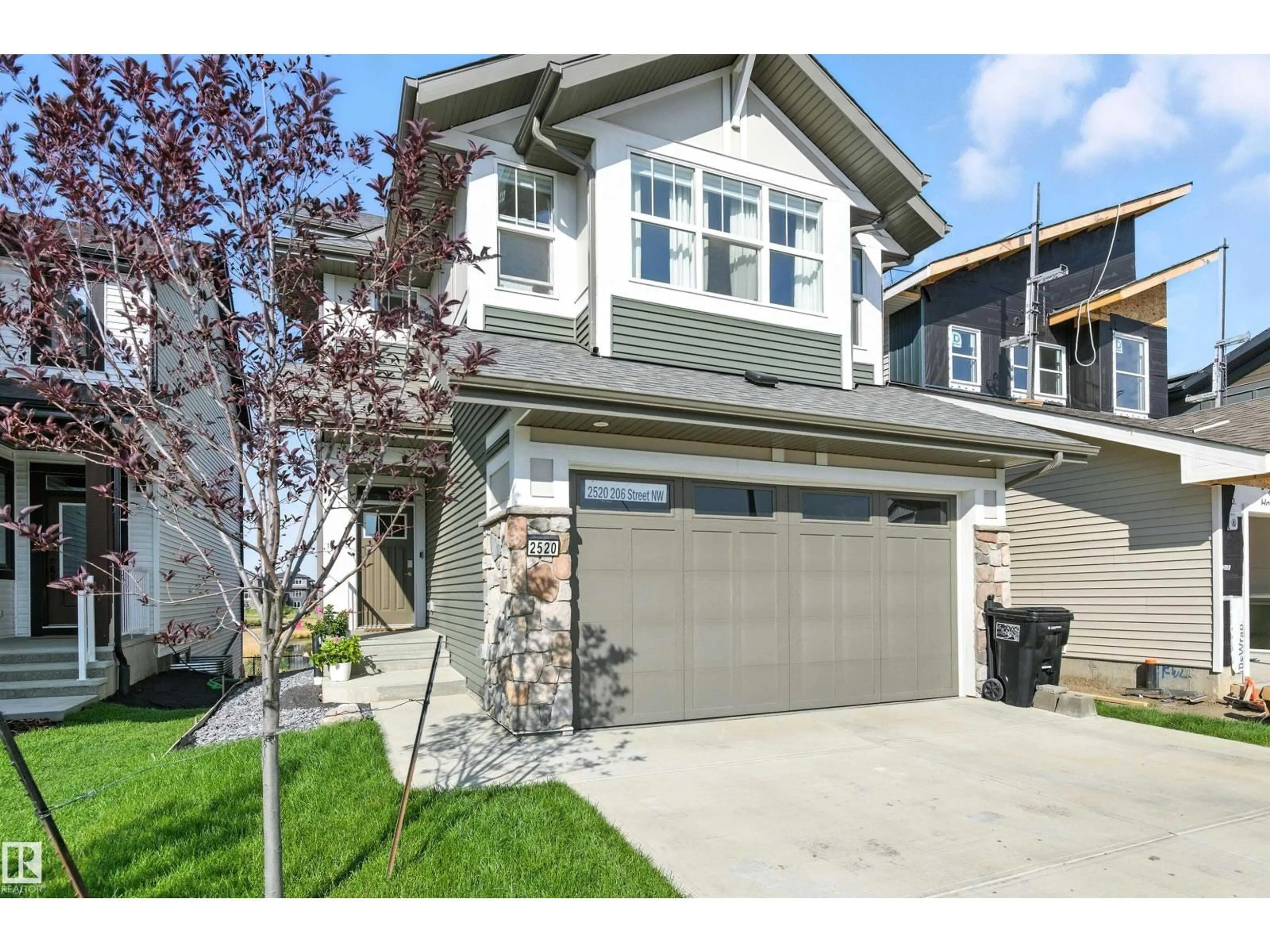 Home with vinyl exterior material, street for NW - 2520 206 ST, Edmonton Alberta T6M1P1