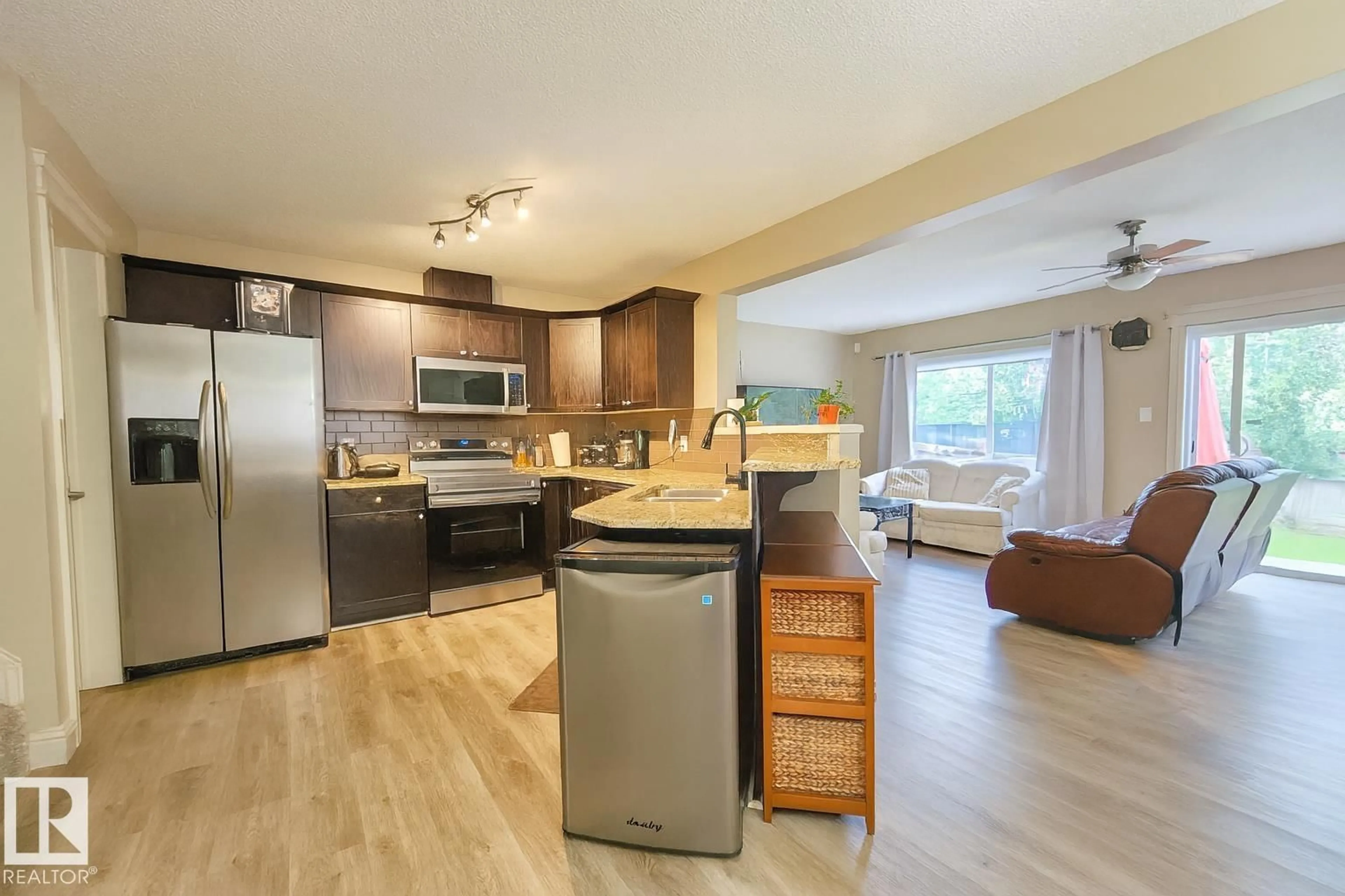 Open concept kitchen, wood/laminate floor for 6109 13 AV, Edmonton Alberta T6X0M6