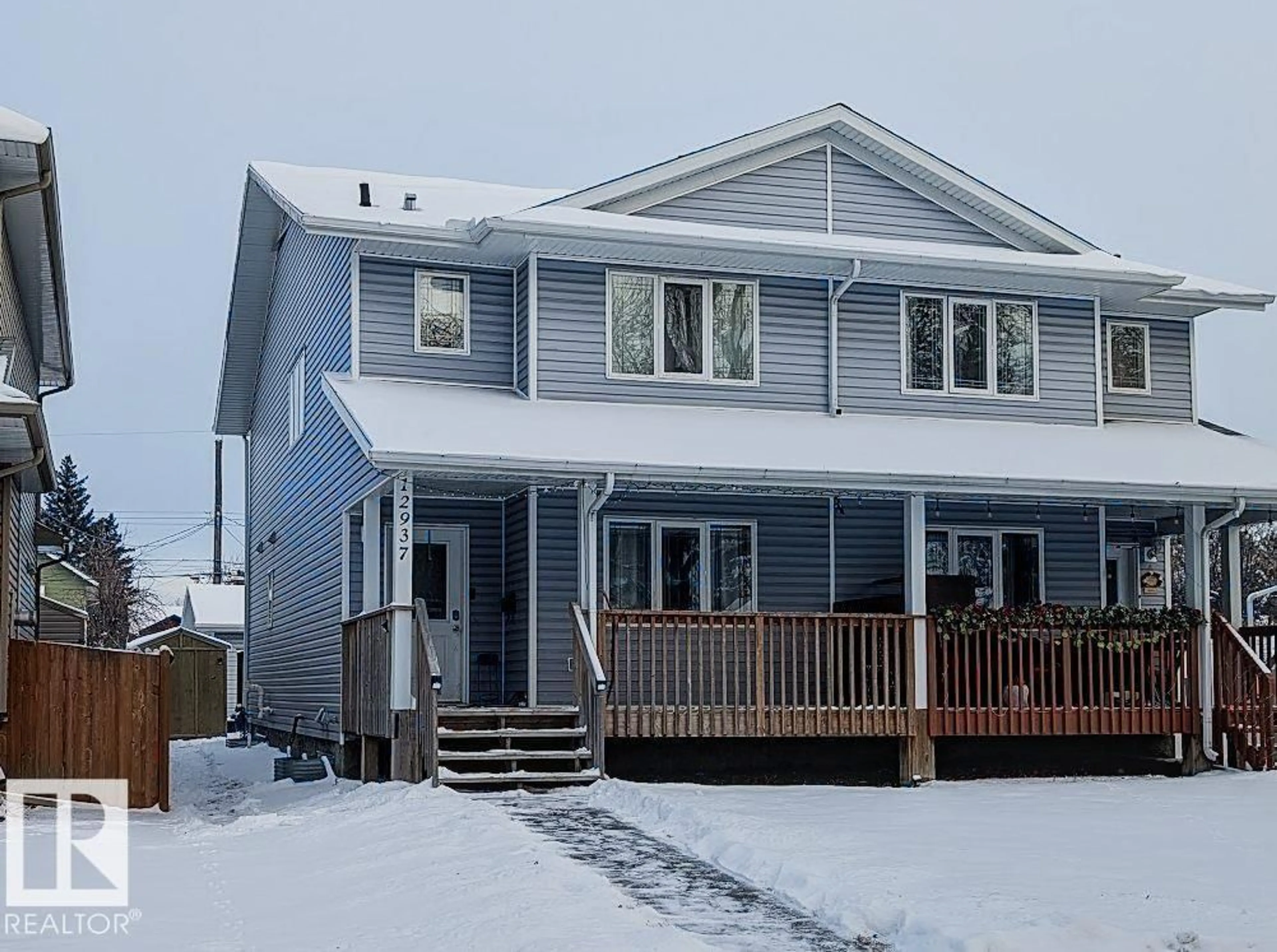 Home with vinyl exterior material, street for 12937 70 ST, Edmonton Alberta T5C0K1