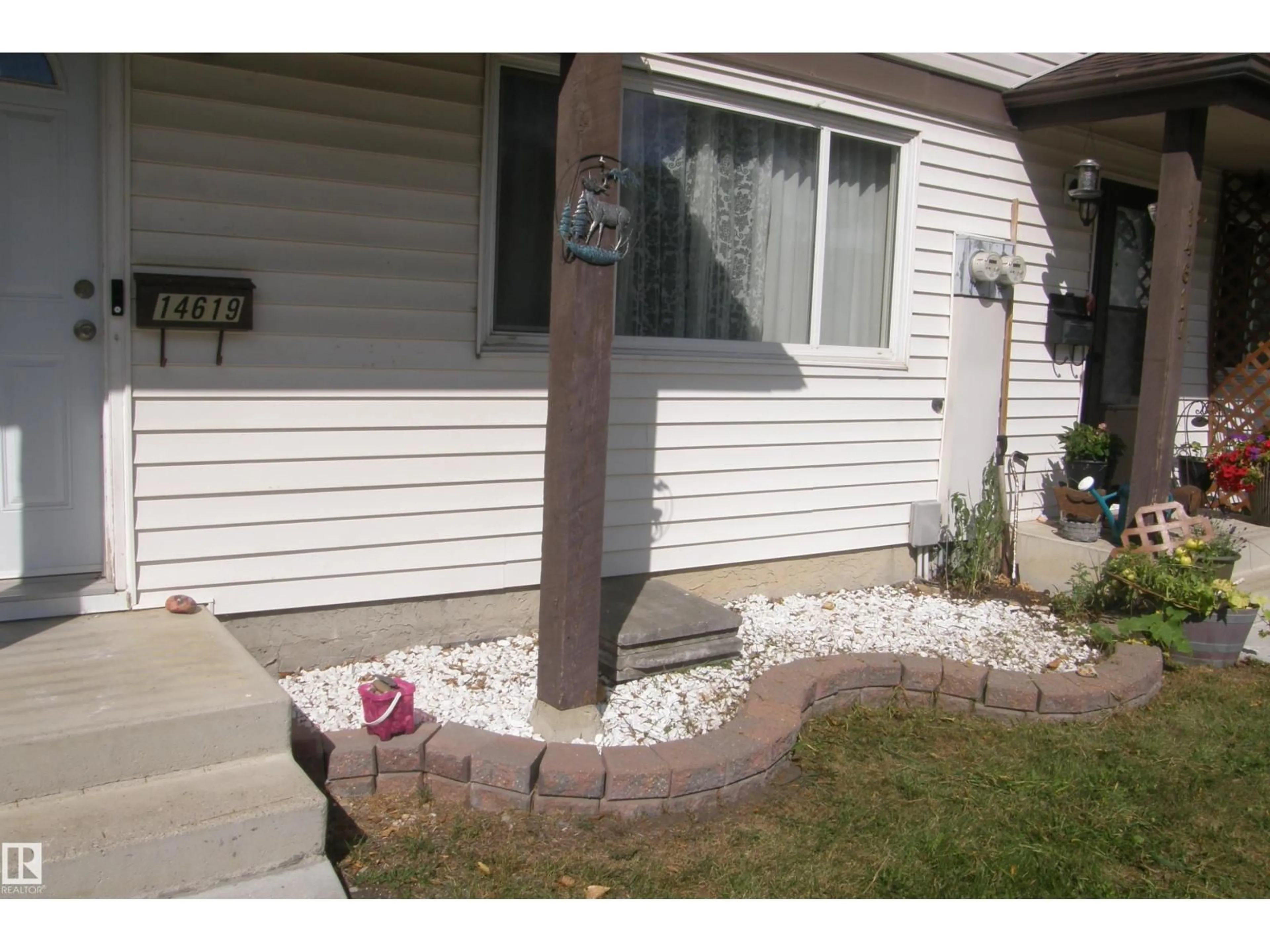 Home with vinyl exterior material, street for 14619 55 ST, Edmonton Alberta T5A4L7