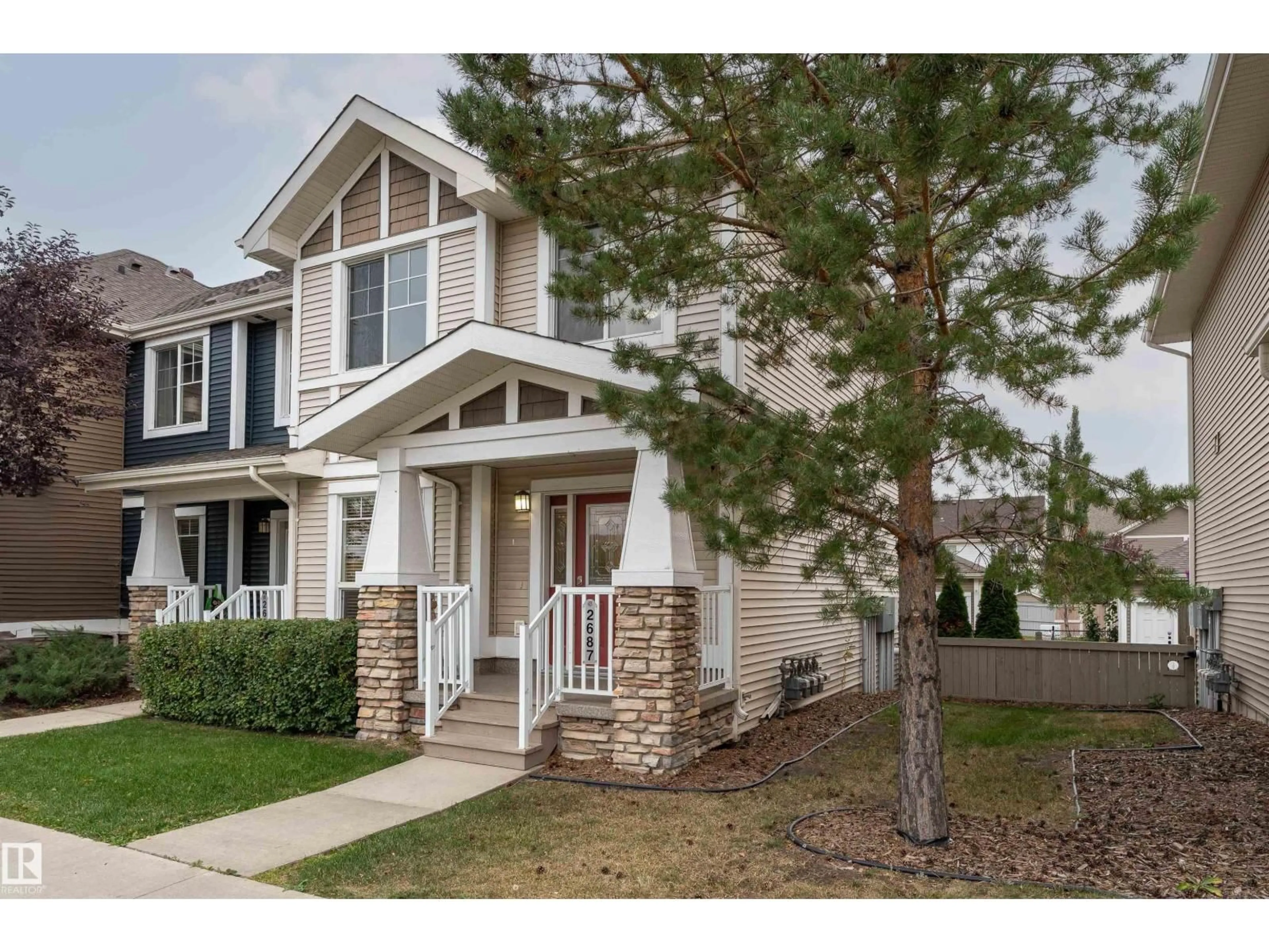 Home with vinyl exterior material, street for 2687 SIR ARTHUR CURRIE WY, Edmonton Alberta T5E6S8