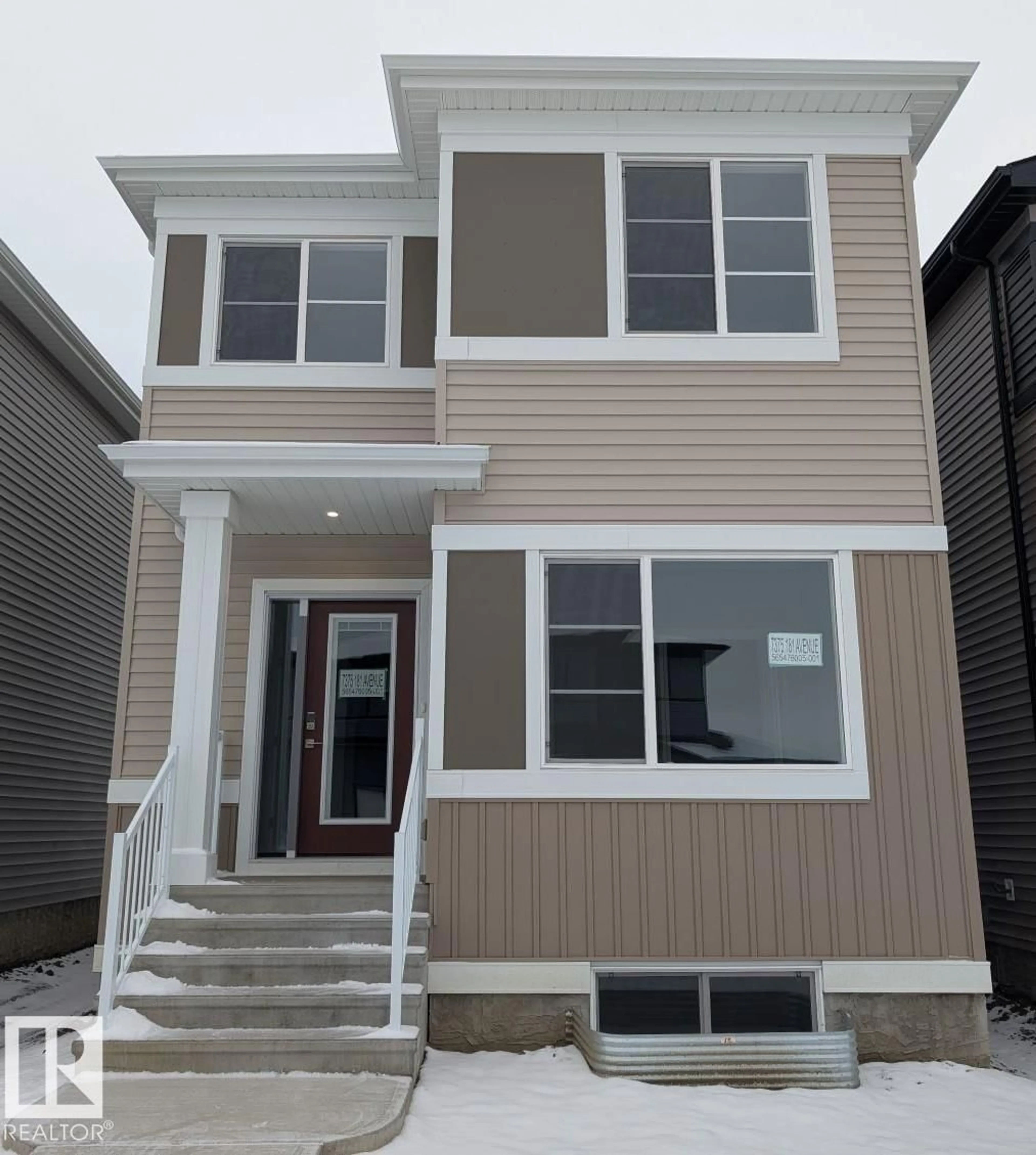 Home with vinyl exterior material, street for 7375 181 AV, Edmonton Alberta T5Z0J1
